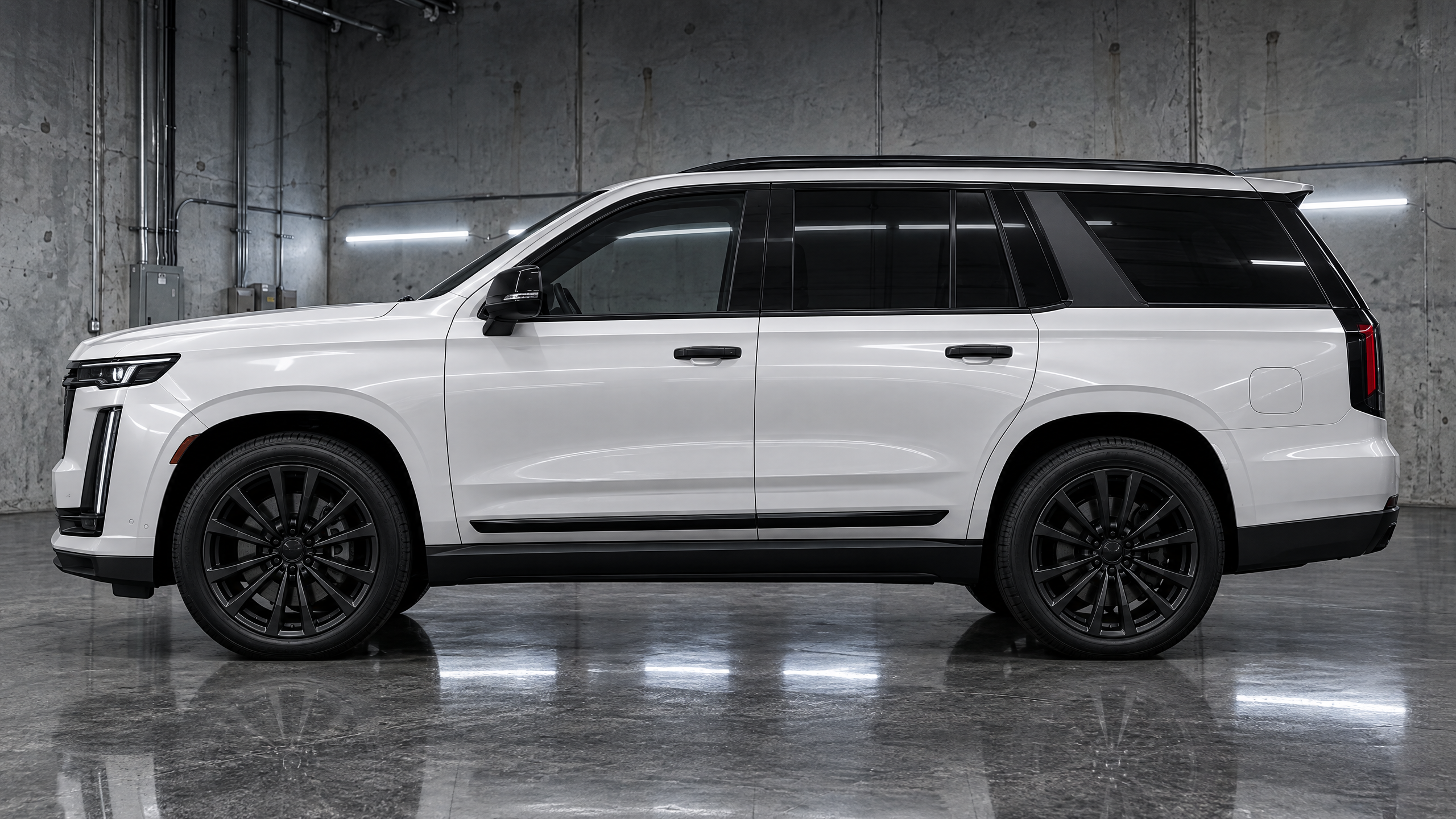 Satin black chrome delete and window trim wrapping on a full-size luxury SUV in Houston, Texas. Precision emblem and side molding blackout services for high-end vehicles.