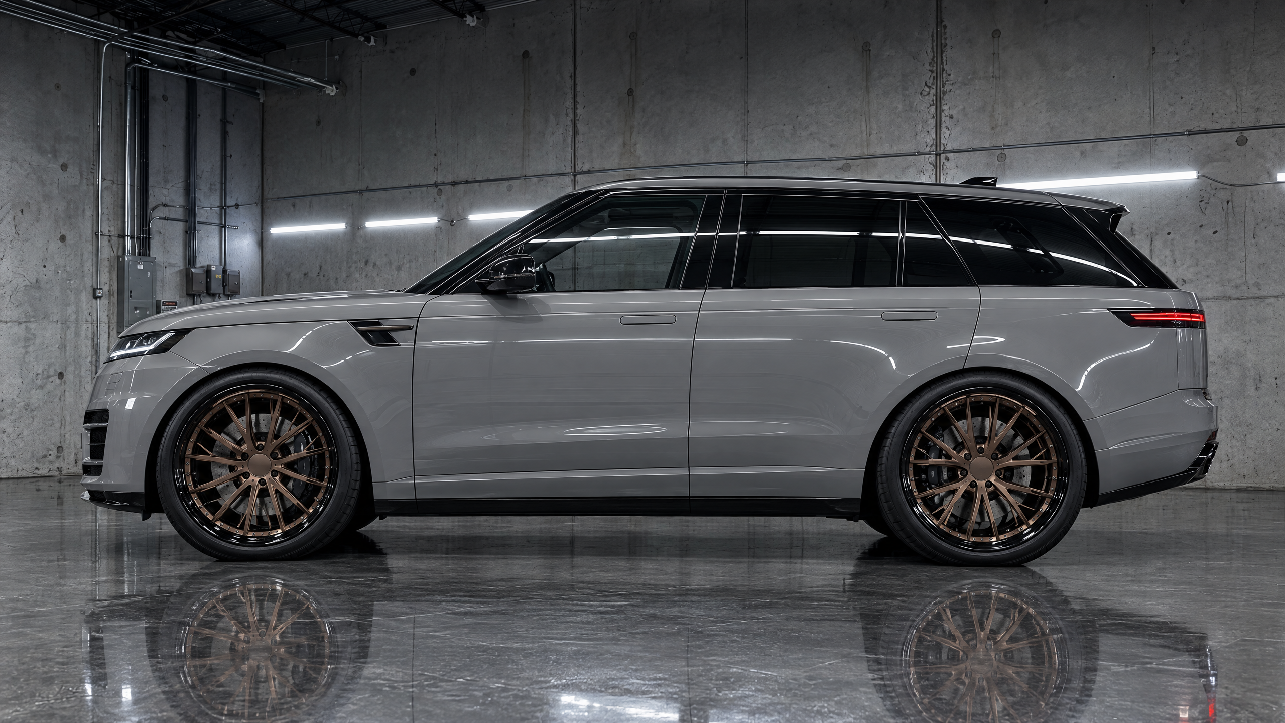 22-inch satin bronze multi-piece forged wheels on a chalk gray luxury SUV in Houston, Texas. Custom wheel styling and performance fitment for high-end vehicles across the Texas market.