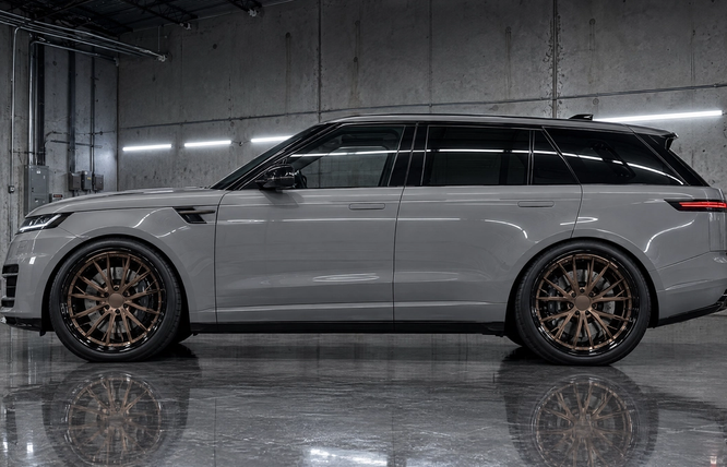 22-inch satin bronze multi-piece forged wheels on a chalk gray luxury SUV in Houston, Texas. Custom wheel styling and performance fitment for high-end vehicles across the Texas market.