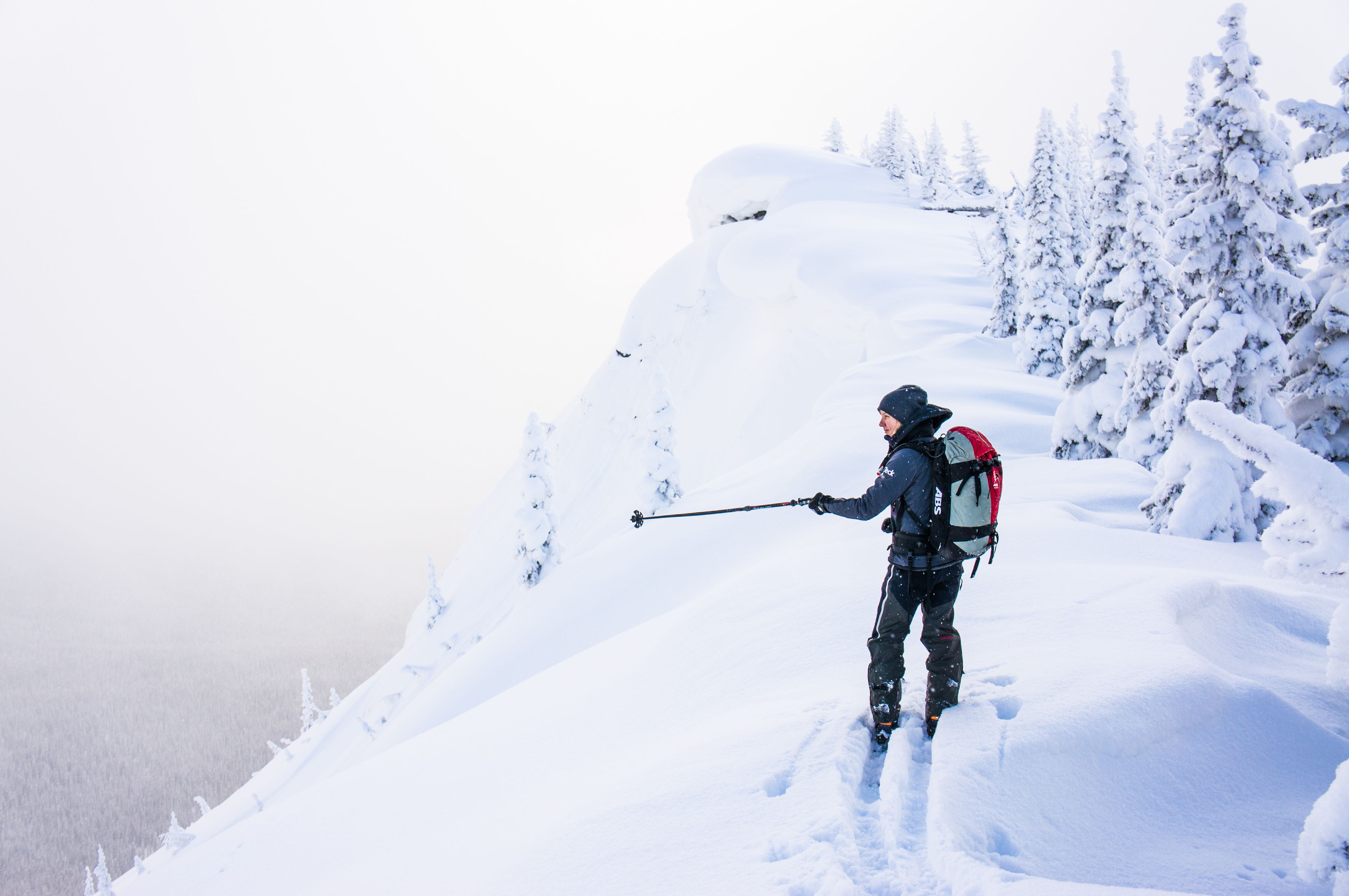 Skier standing on ridge