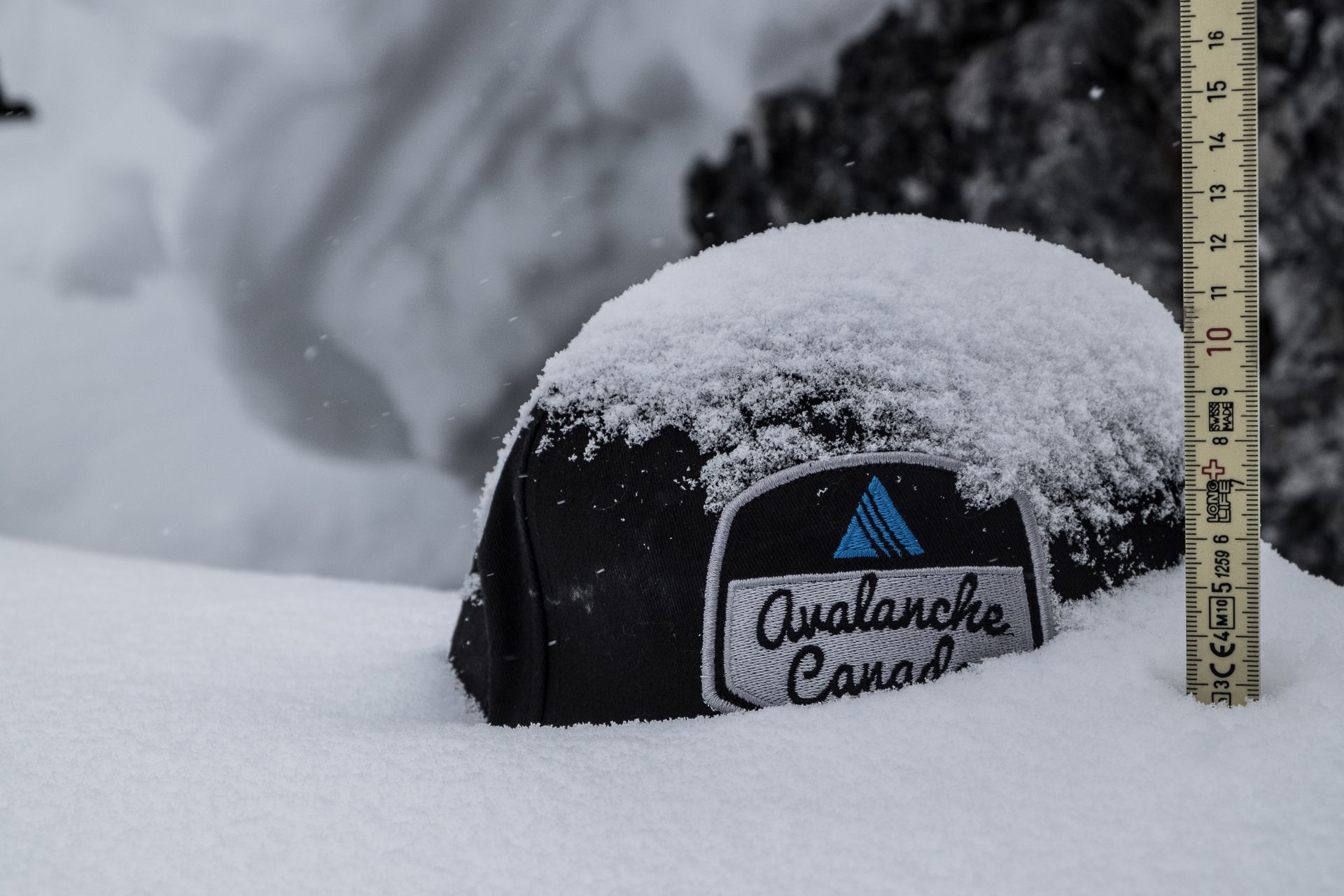 Hat in snow with ruler