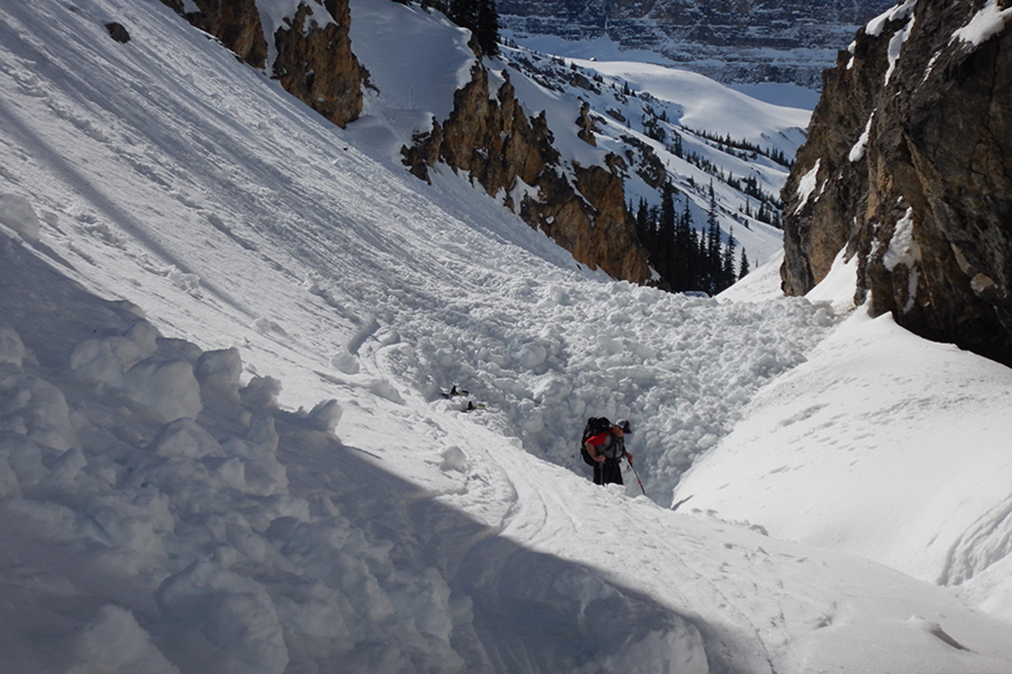 This is a classic terrain trap, where an avalanche from above piled up deeply in the gully. It would have resulted in a full burial for anyone caught in its path.