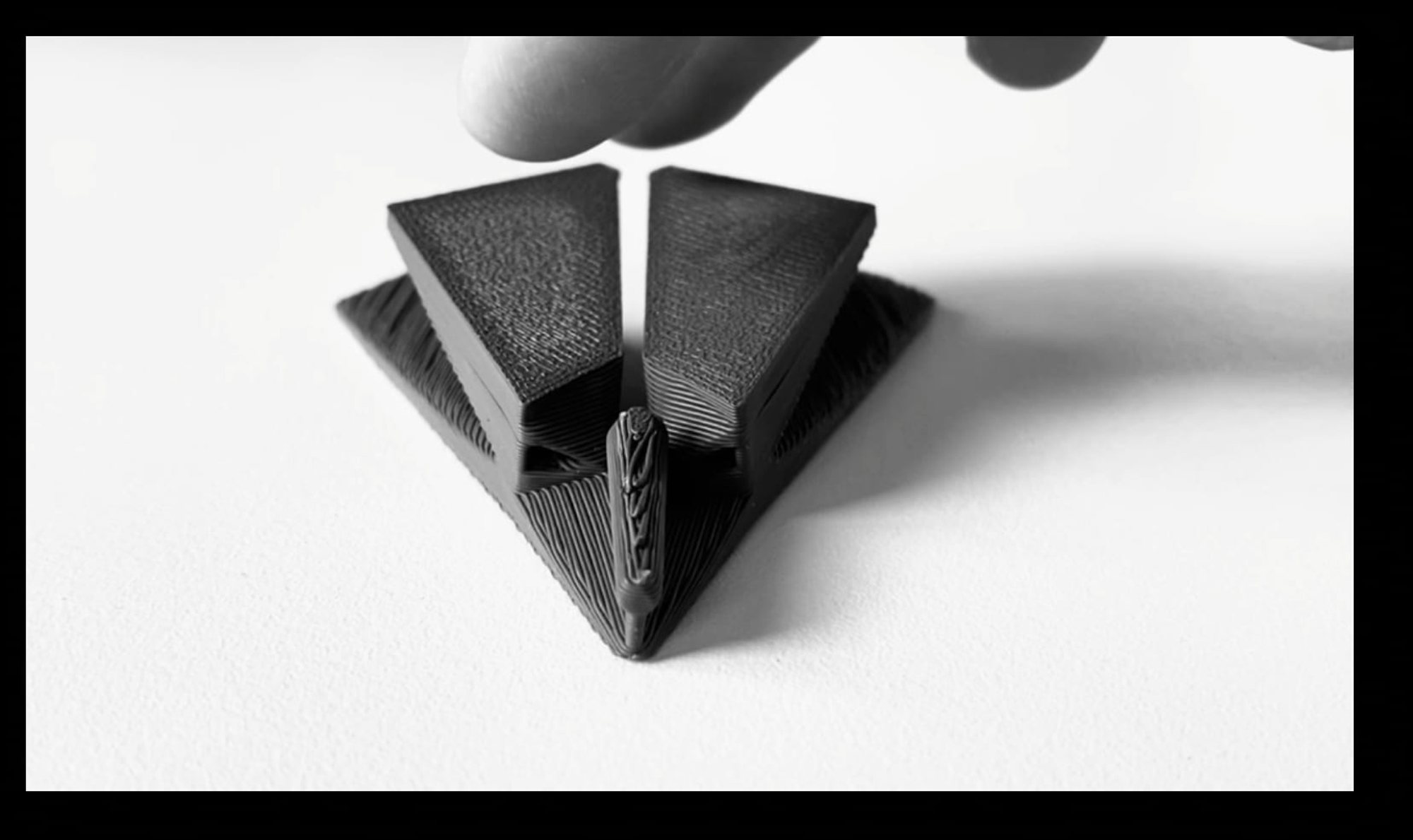 Two printed modules being interlocked by hand