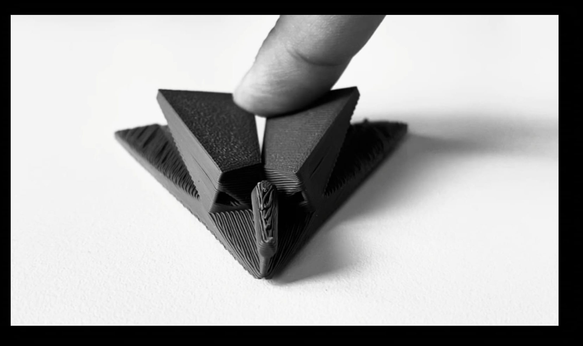Printed module held between fingers