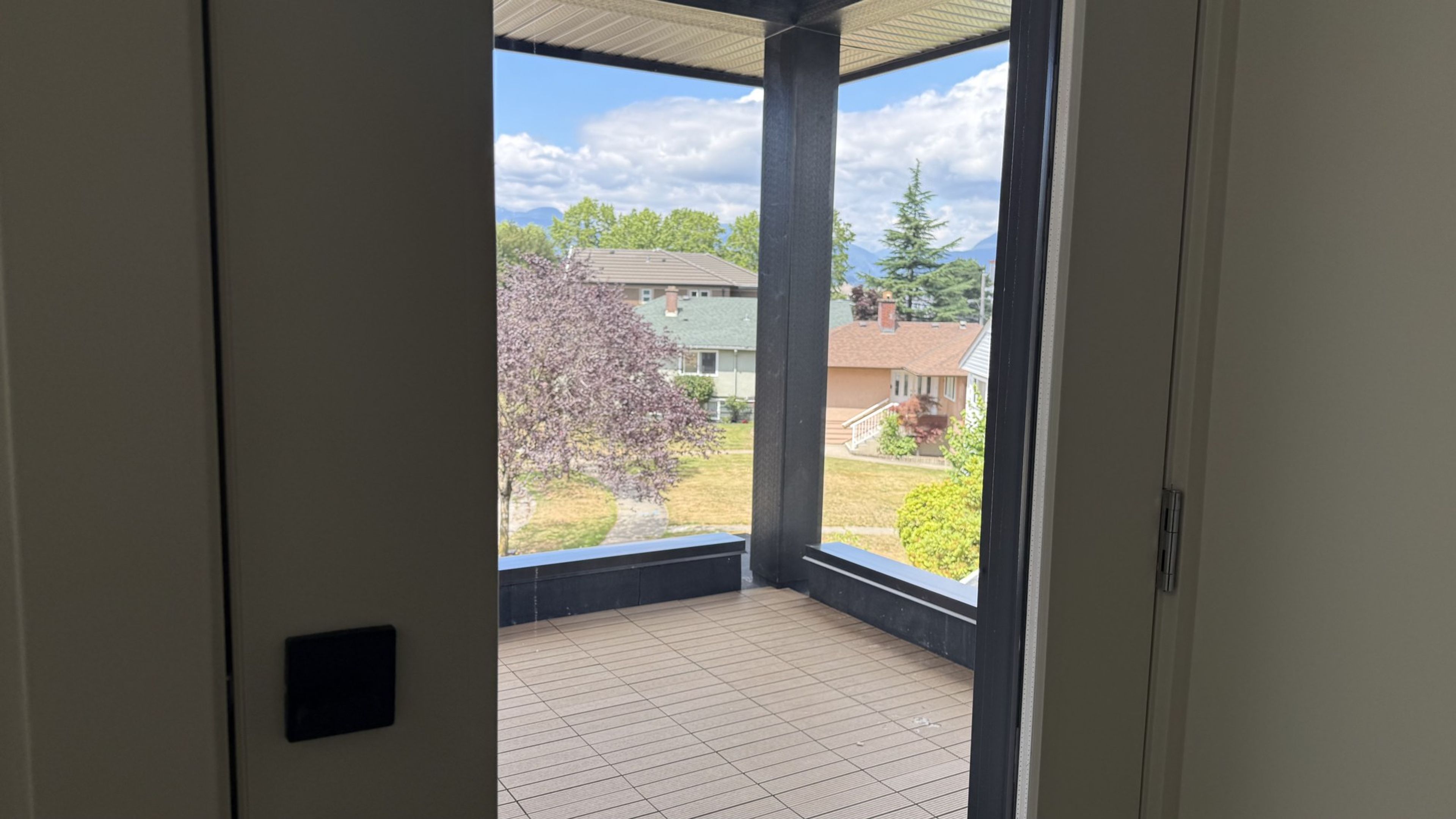 Upper-level deck access bringing daylight into the top floor