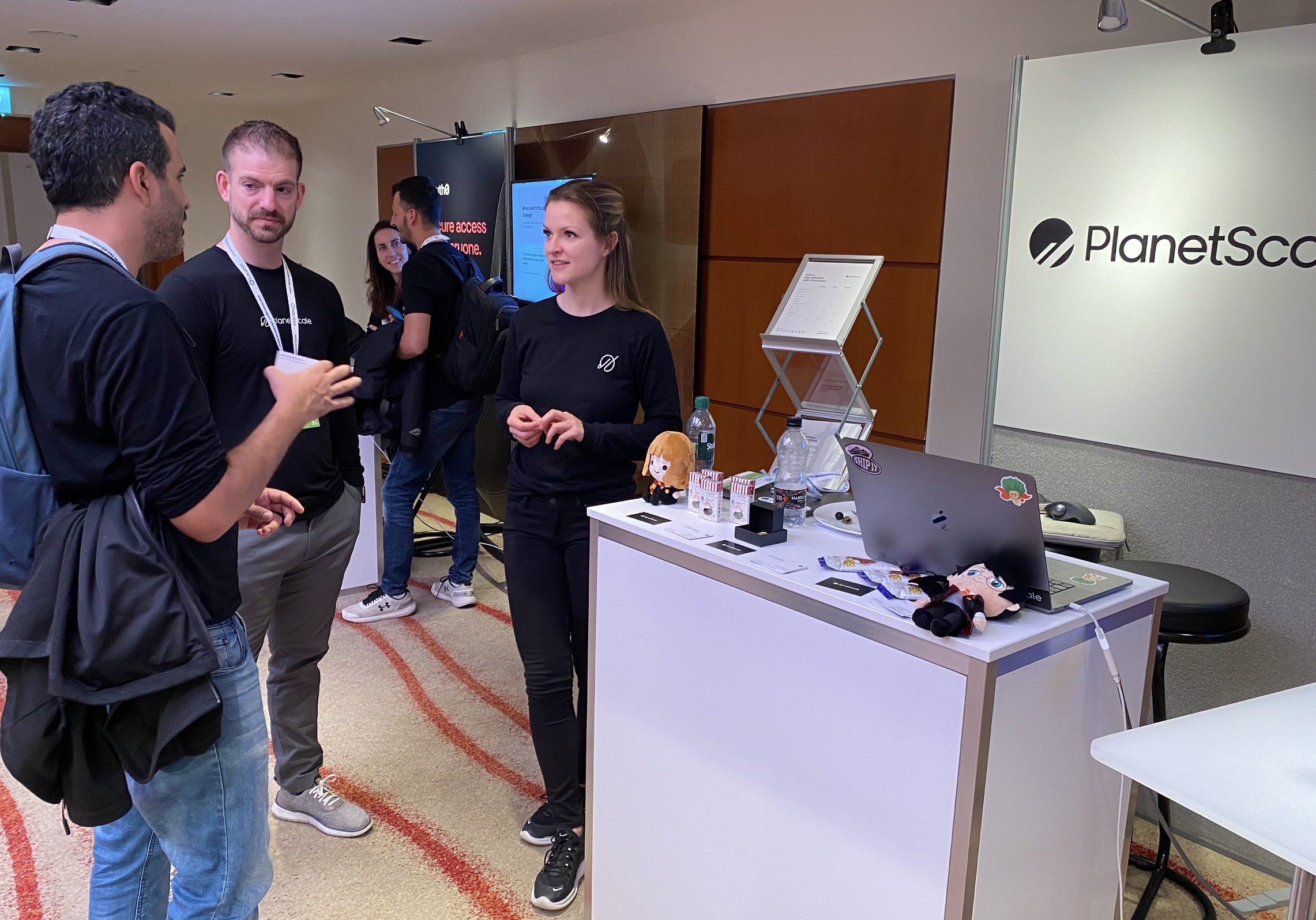 James at the conference booth at DevOpsCon
