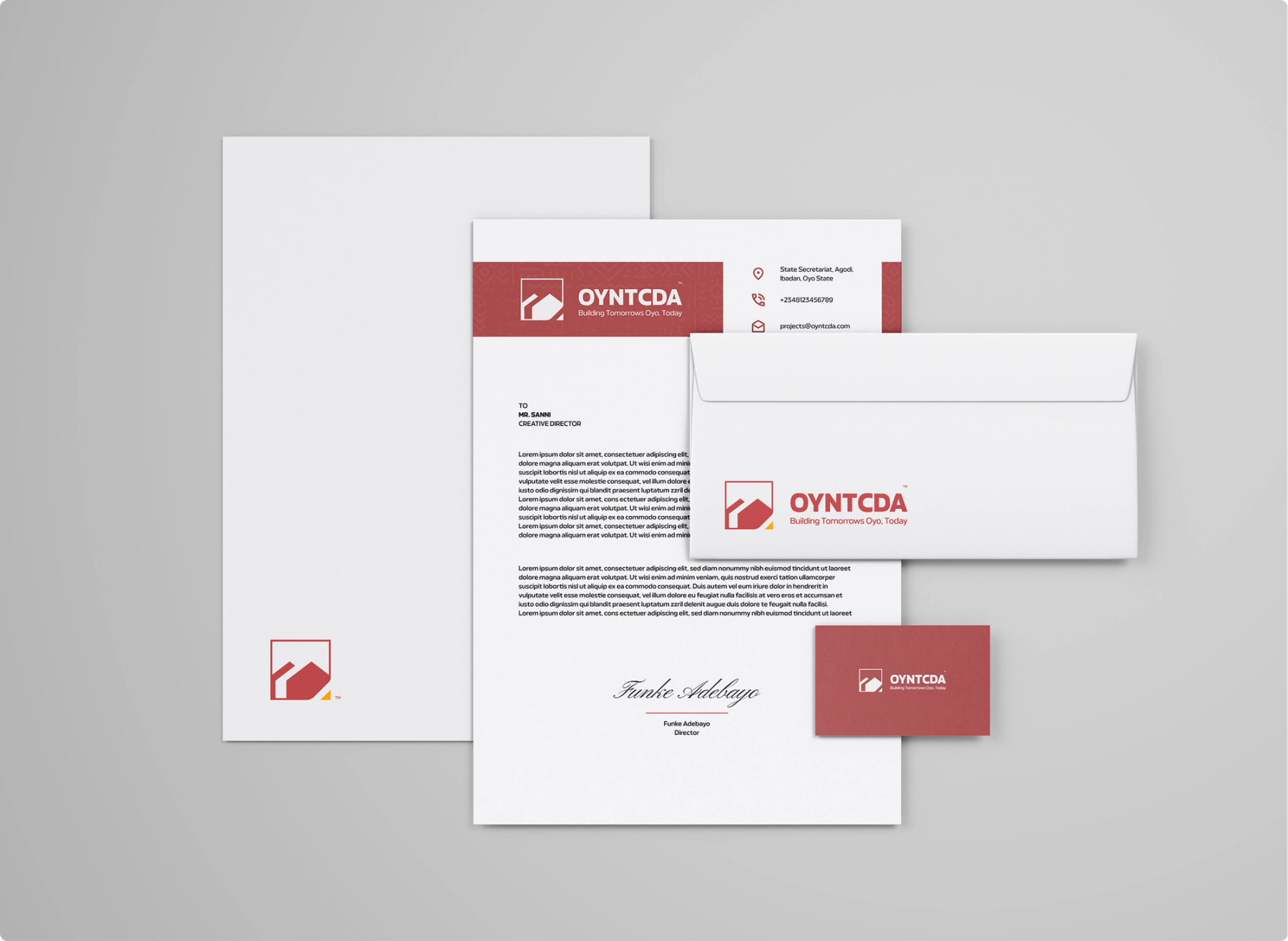 OYNTCDA letterhead, envelope and business card with a red patterned header