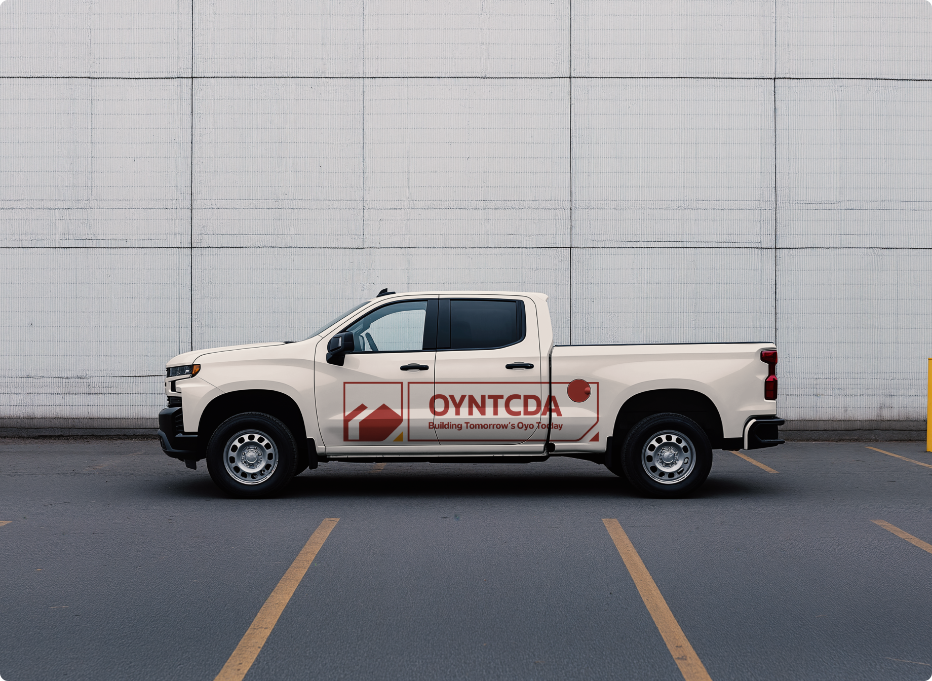 OYNTCDA identity applied to the side of a cream pickup truck