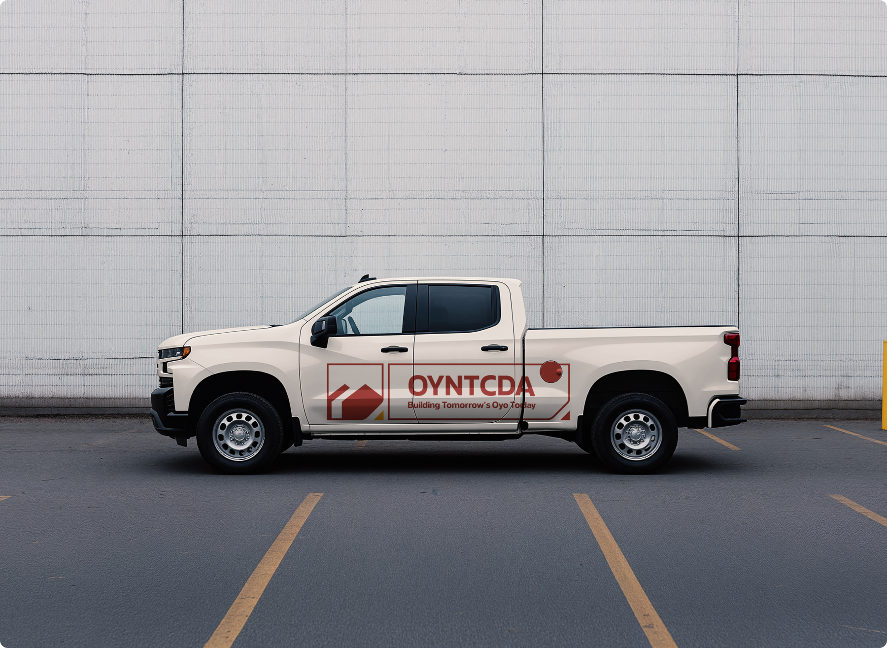 OYNTCDA identity applied to the side of a cream pickup truck