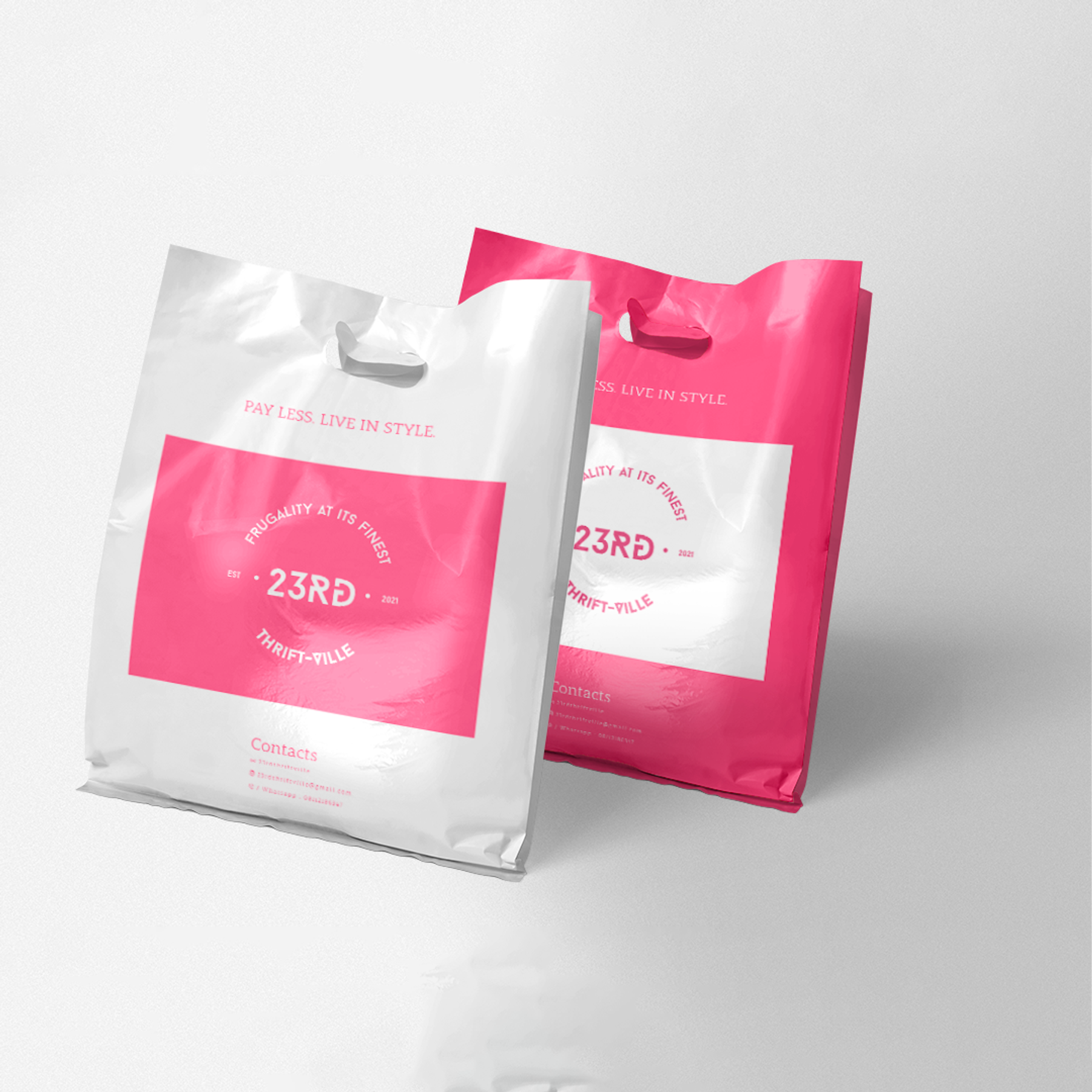 23rd Thrift Ville identity applied to pink and white shopping bags