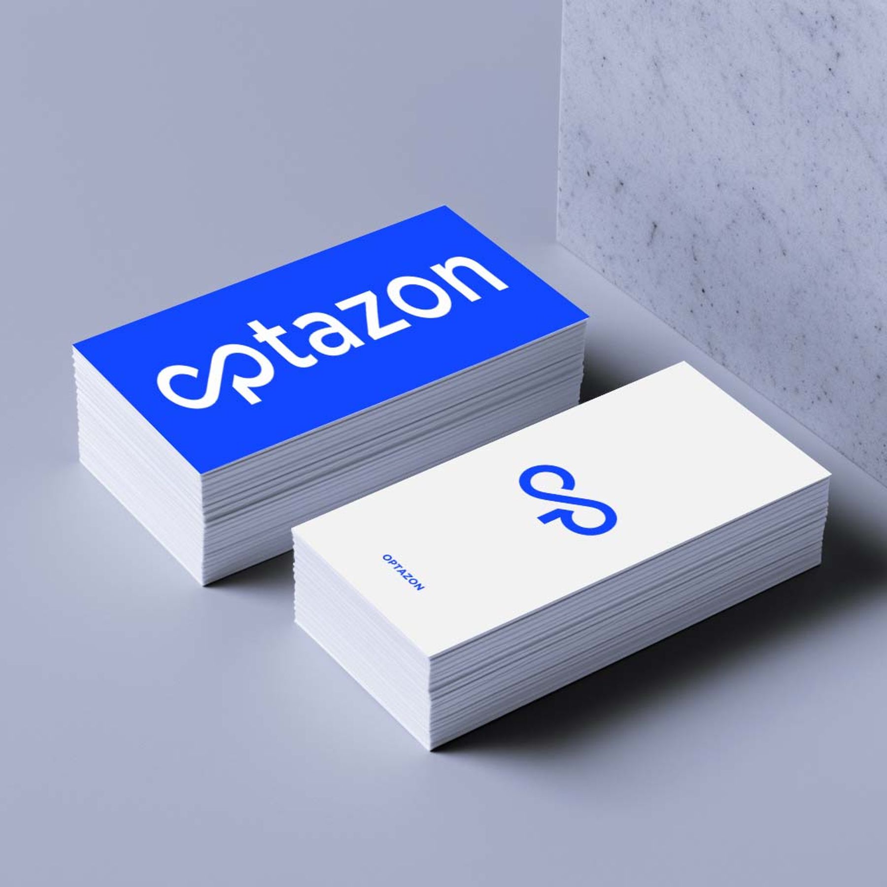 Optazone blue-and-white business-card mockup with continuous monogram