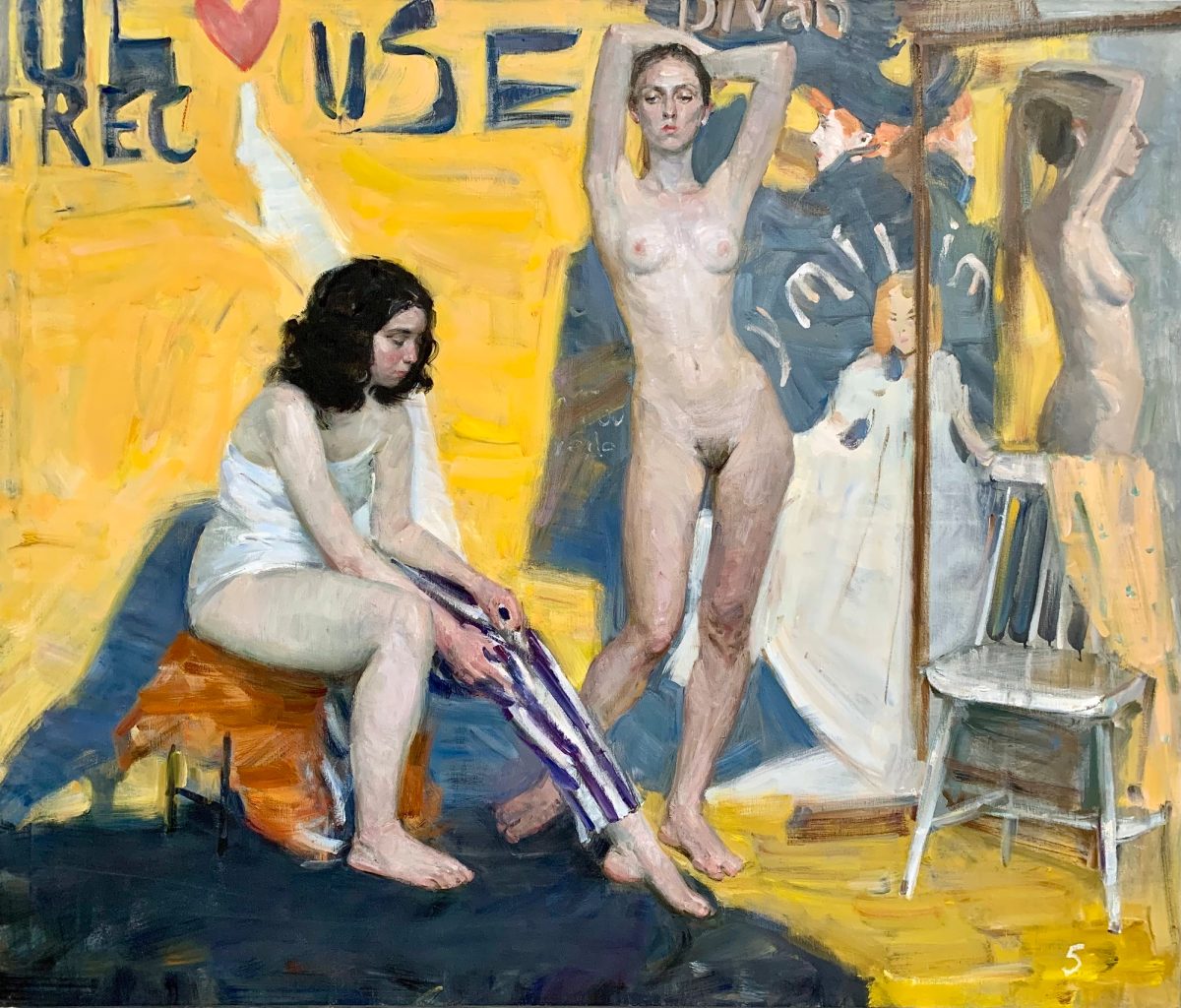 Two nude figures in a studio, one standing with raised arms and one seated beside draped fabric.
