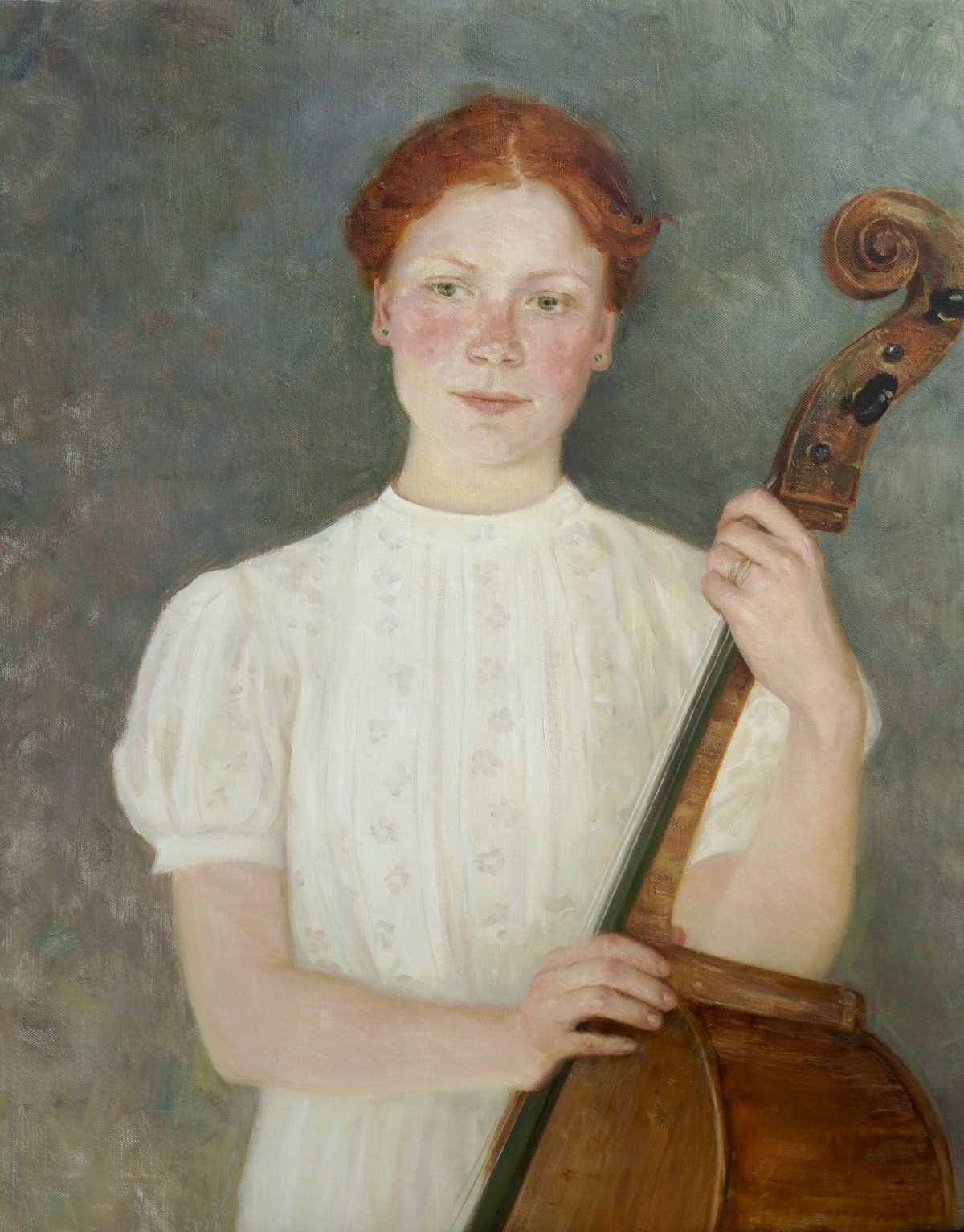 Portrait of a woman in a white blouse holding a cello.