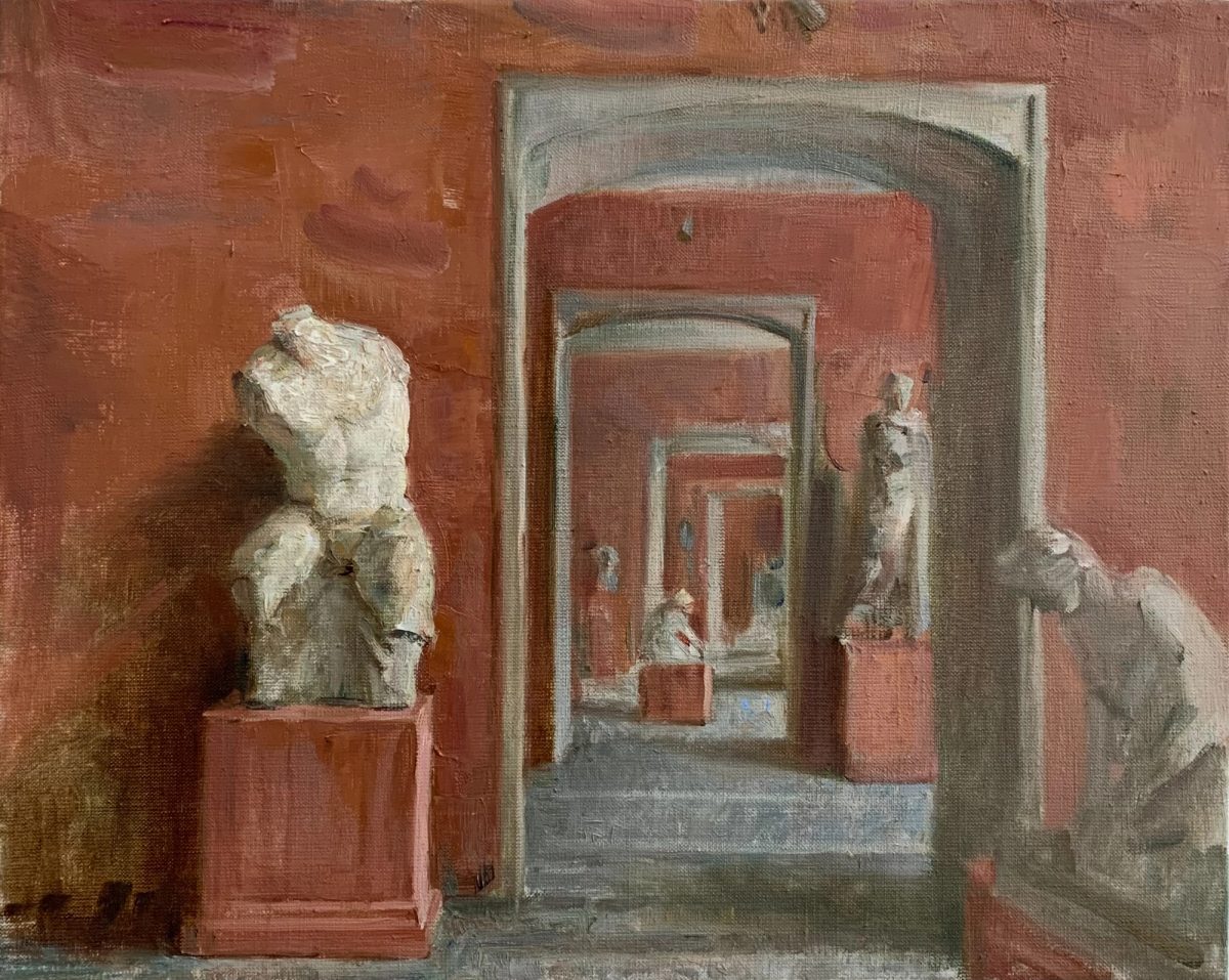 White plaster bust in a red gallery with a sequence of doorways and sculptures.