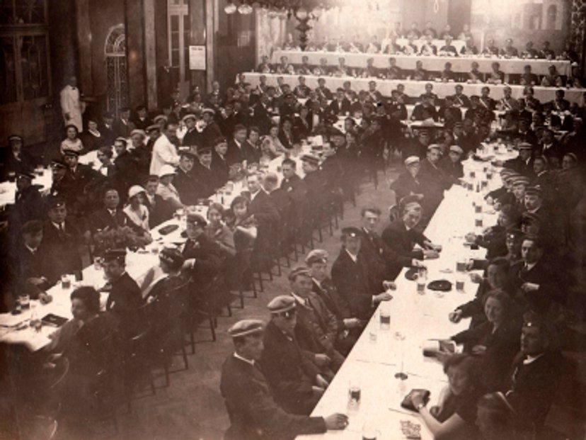 Black/White photo of the ballroom filled with soviet soldiers