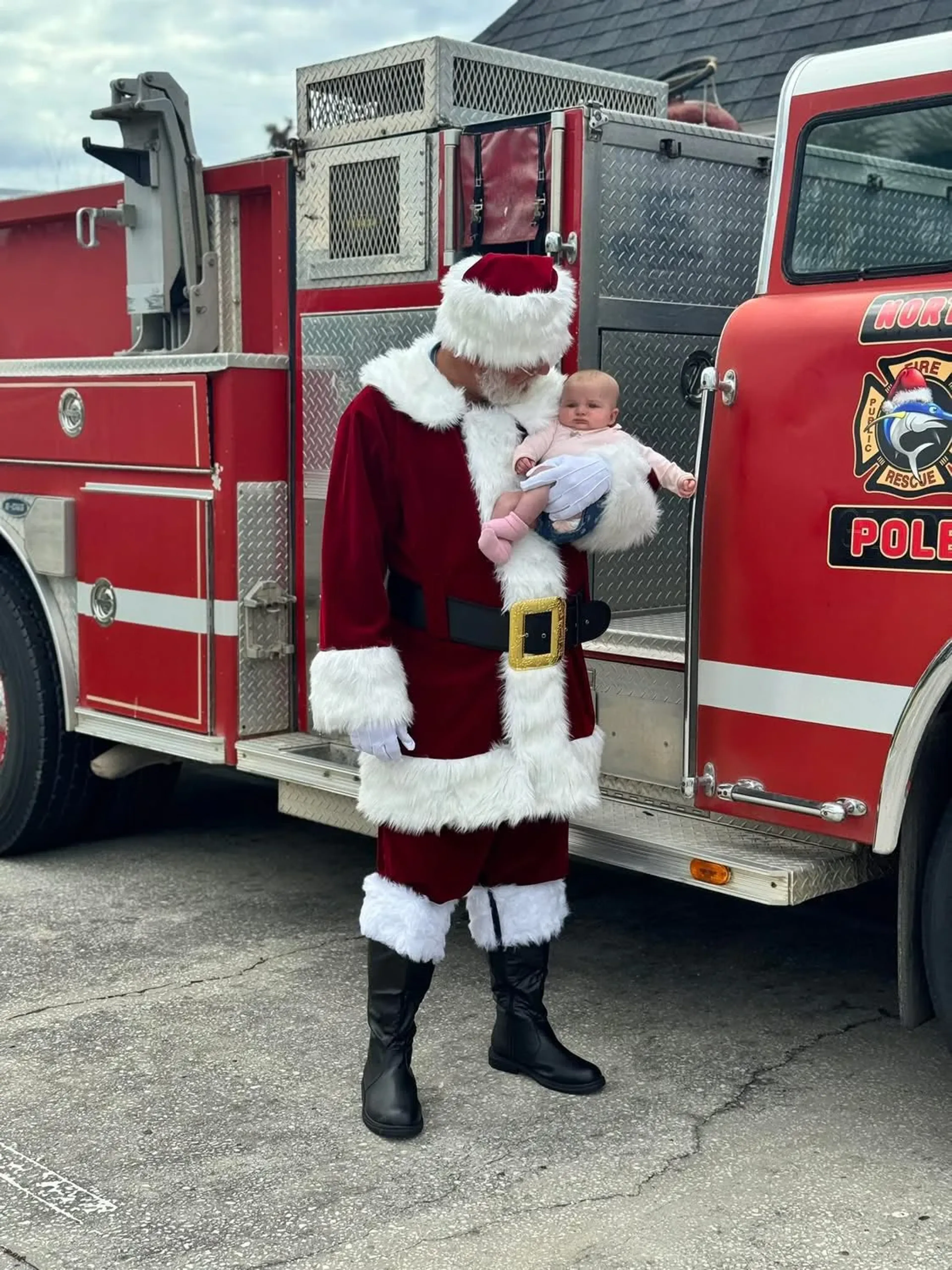 Santa arriving on a fire truck at Market Day Christmas, December 2025