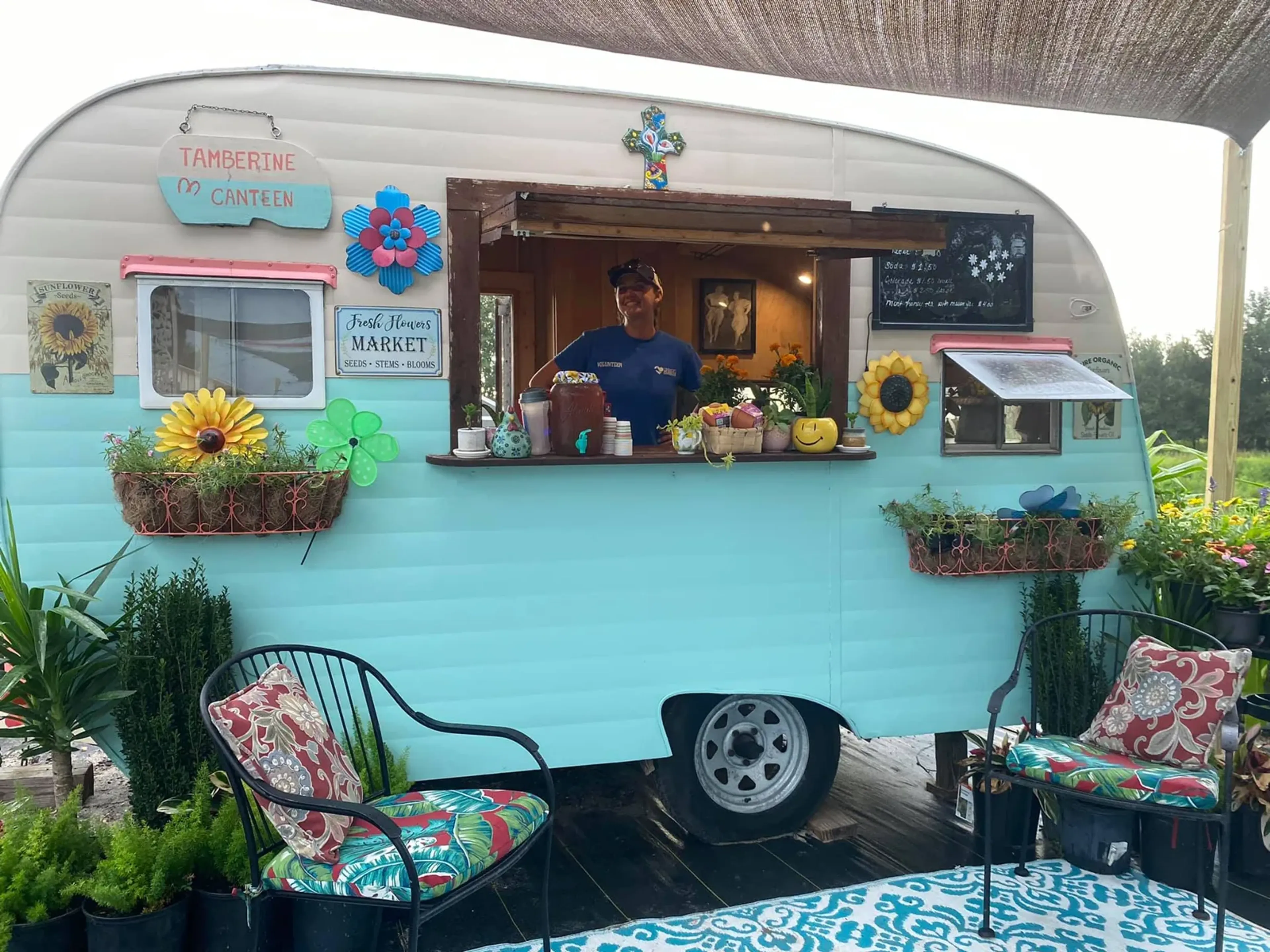 Vintage aqua camper market stand with sunflowers at Market Day, September 2021