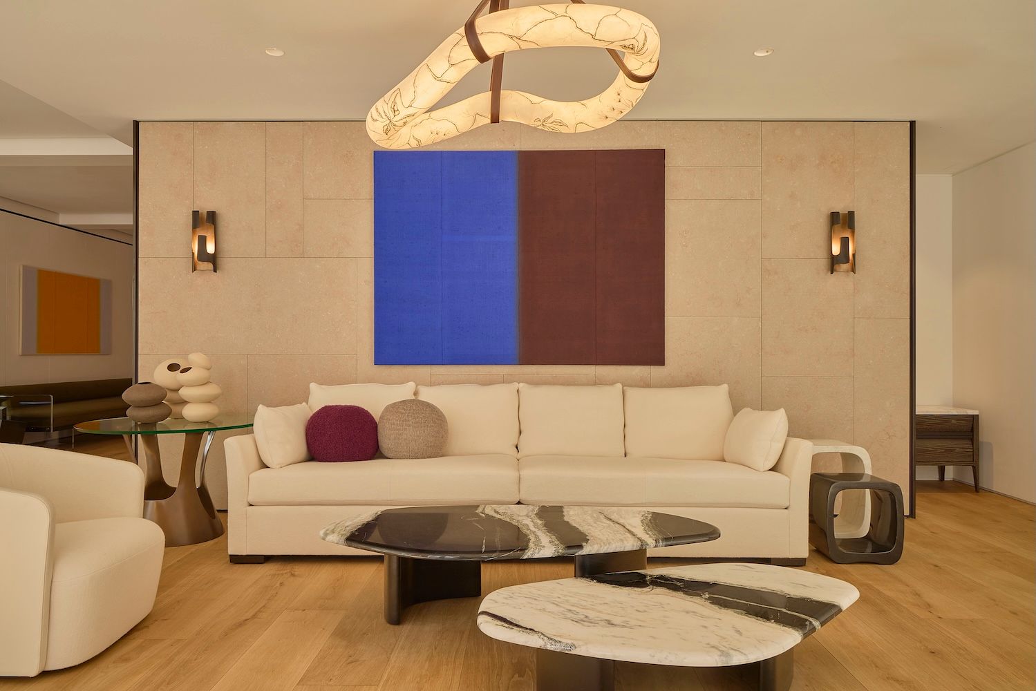 Interior environment with white sofa and coffee tables which is the Holly Hunt showroom in Mayfair 