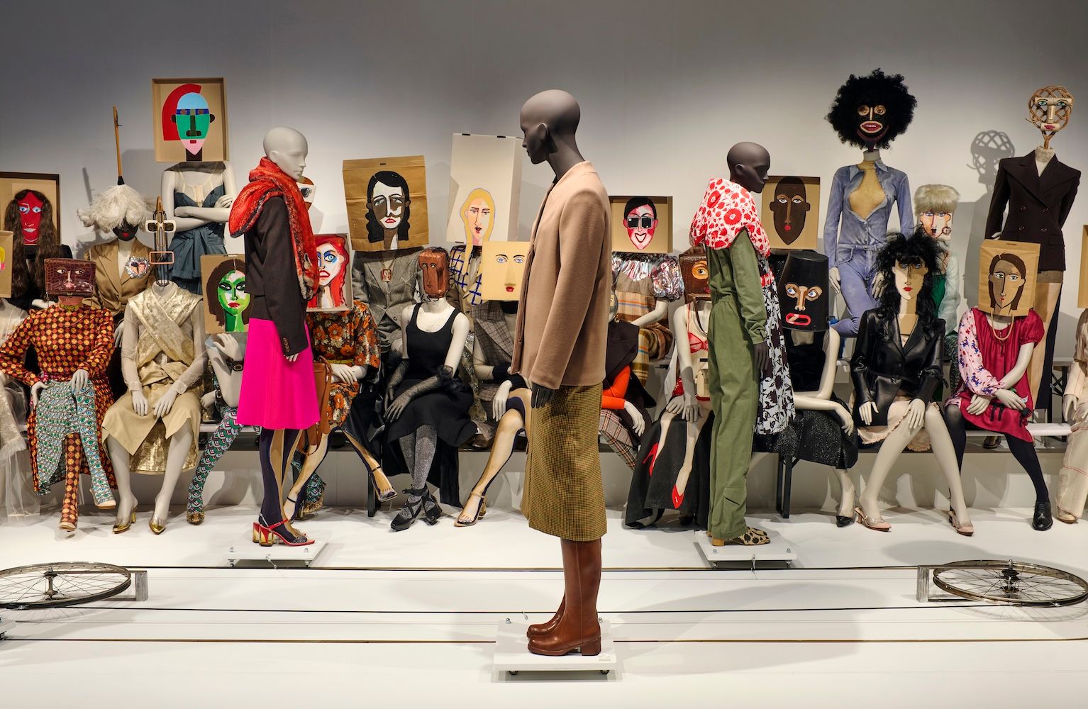 Mannequins on a catwalk with a mannequin audience 