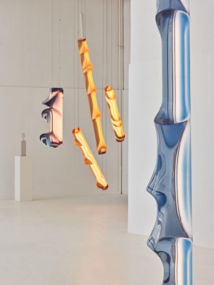 Image of Jean Prouve gas station with blue sky background and blue crisp water in foreground