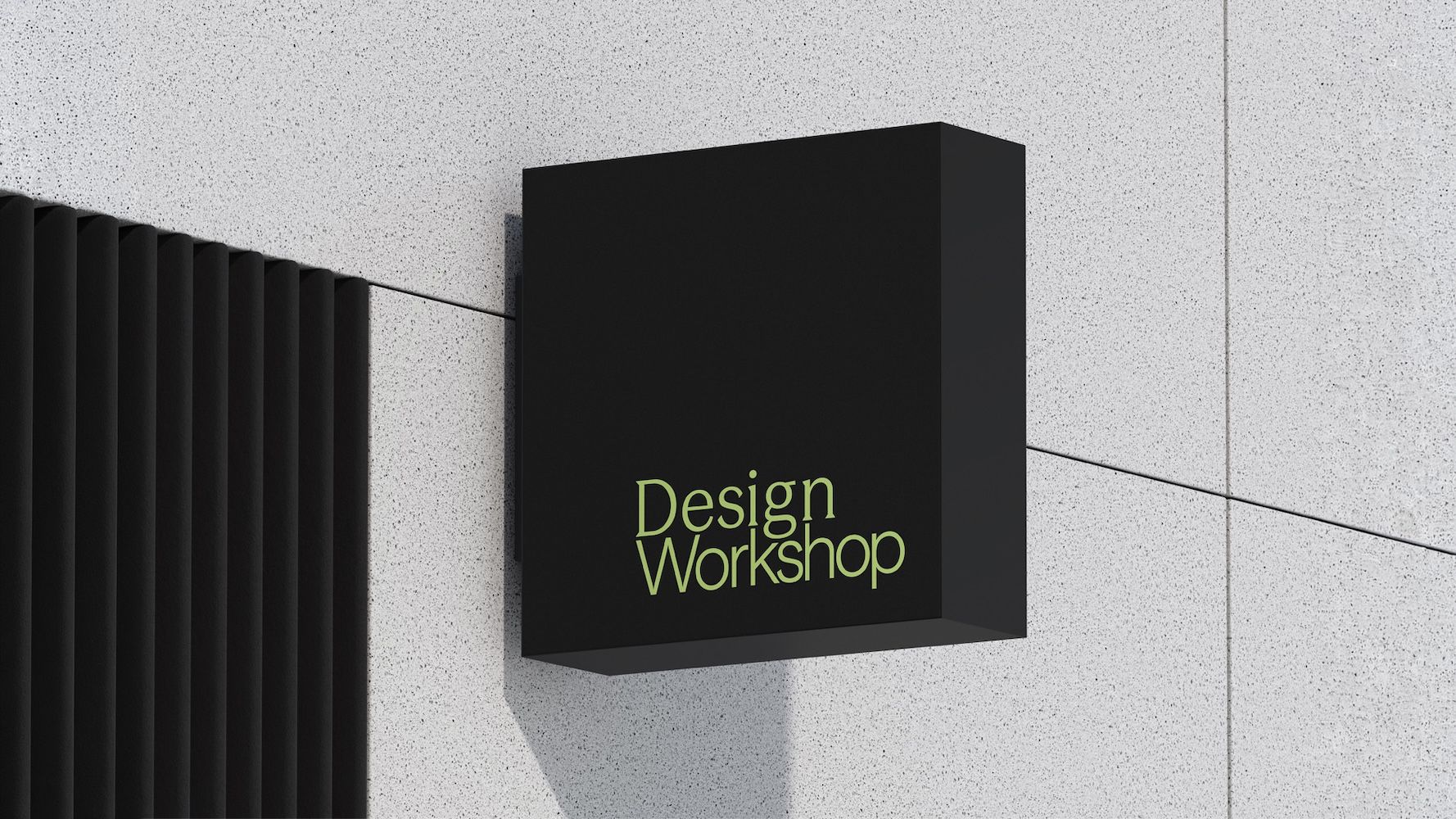 Sign attached to the wall saying Design Workshop 