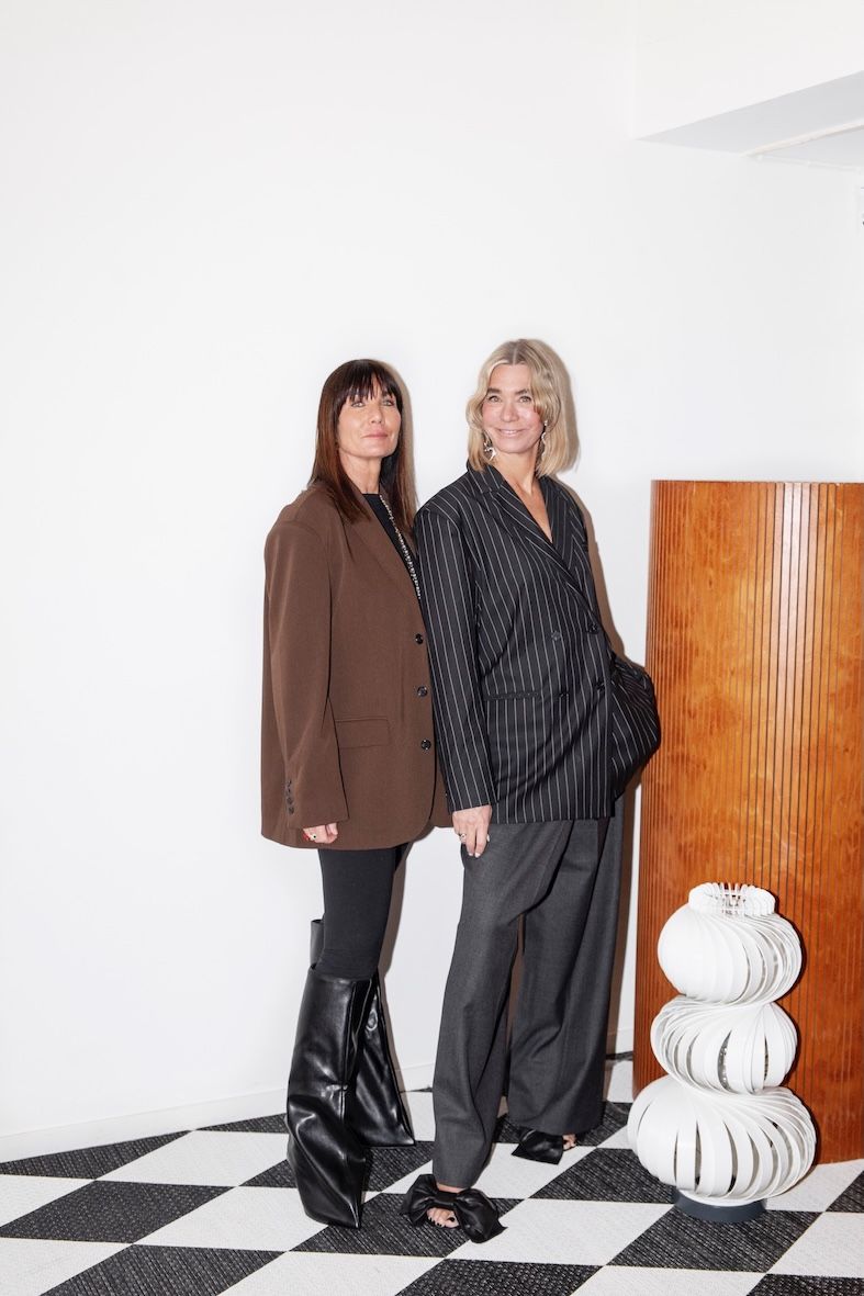 Bolon owners Marie Eklund and Annica Eklund posing in front of screen divider