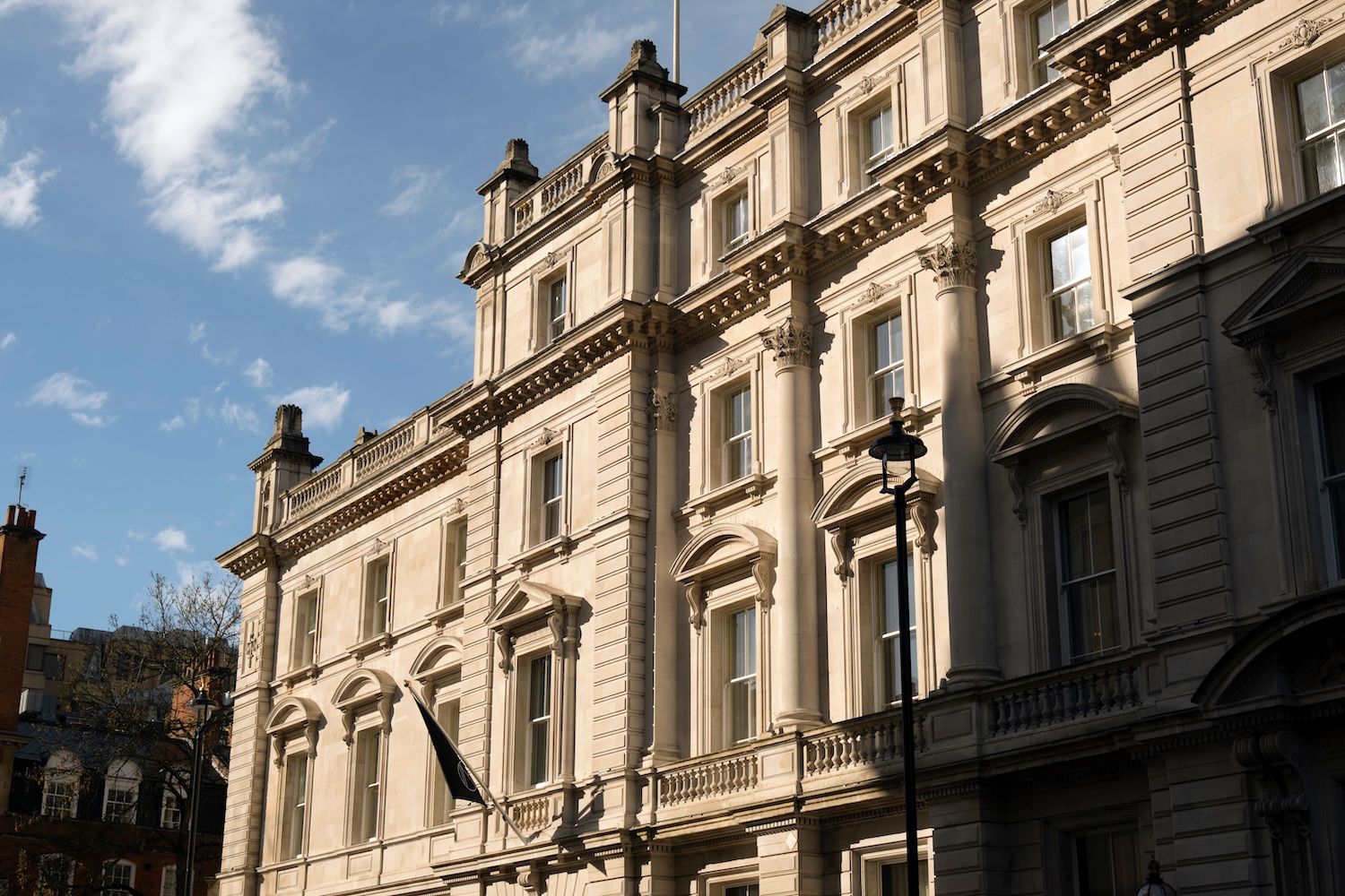 Exterior facade of building with light shining on it 