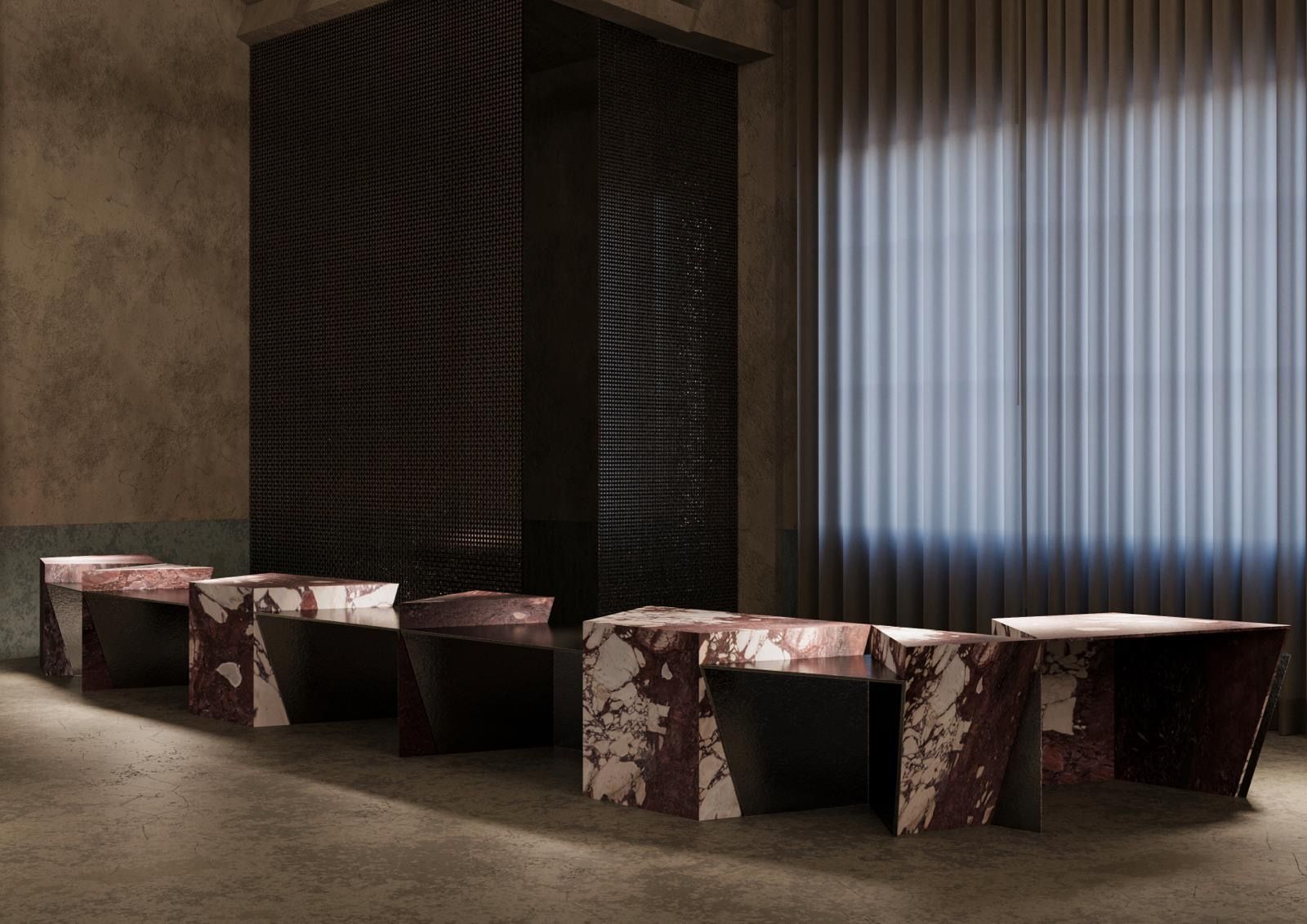 Interior space with seating and marble tables in moody lighting