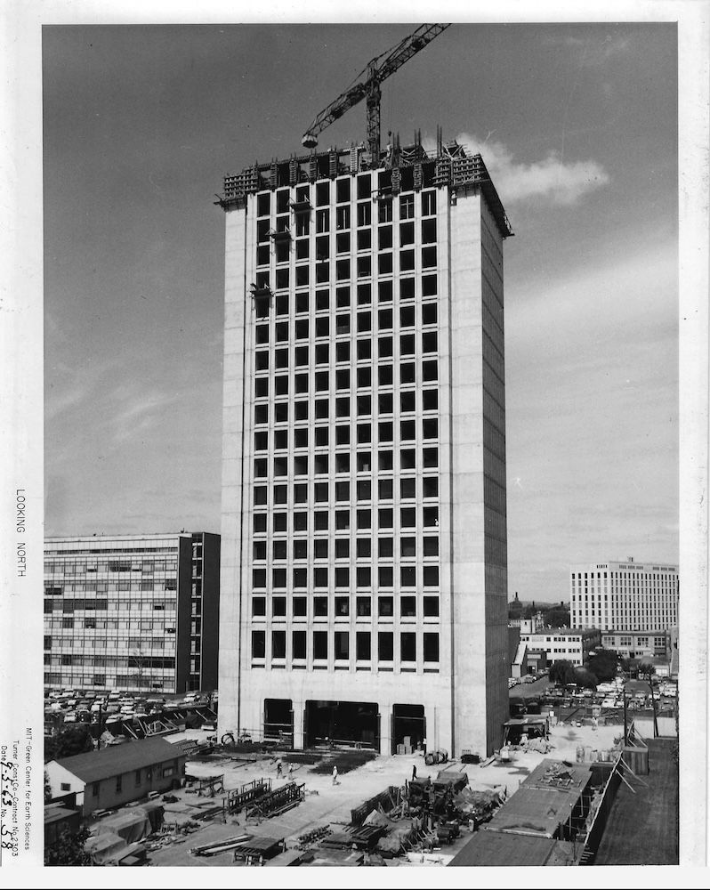 A skyscraper building in a black and white picture 