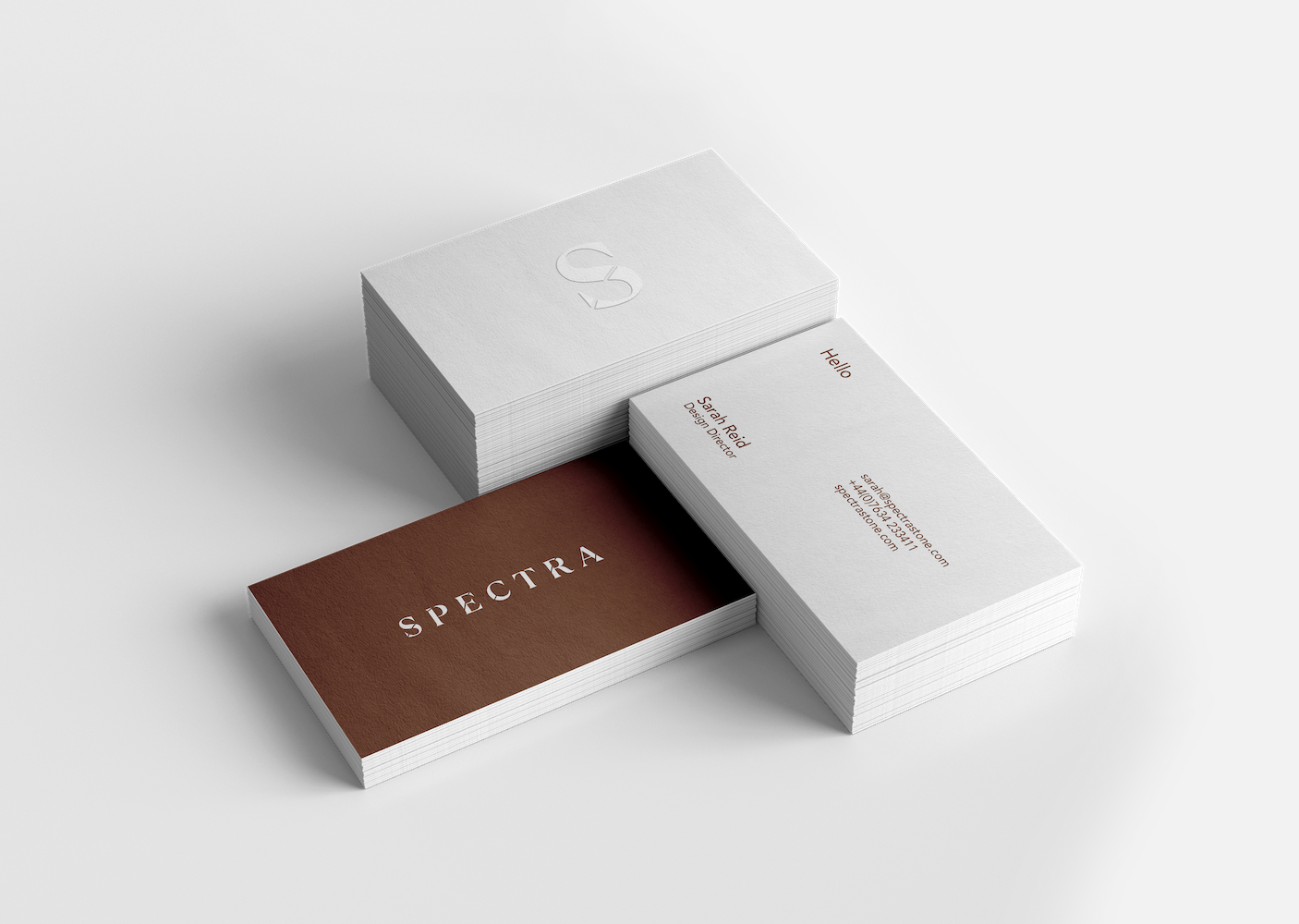 A set of business cards with the Spectra logo on 