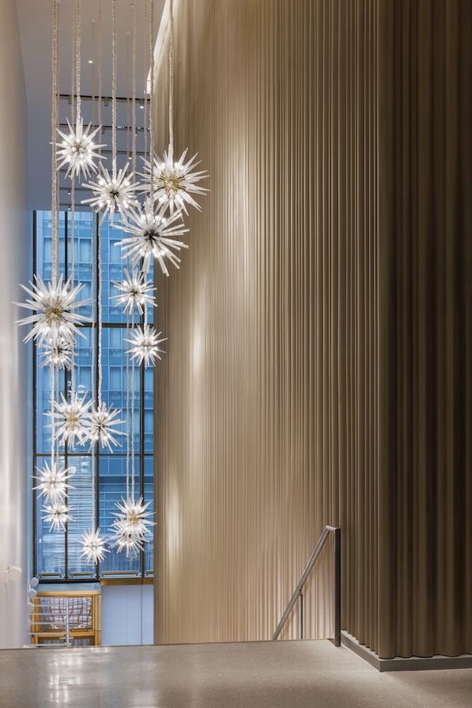 Installation going down staircase of hanging lights