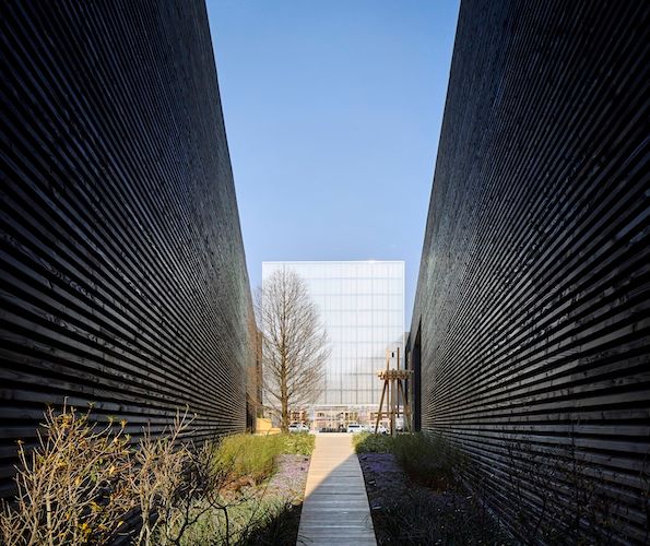 Black walls framing a building at the USA pavilion at the Osaka EXPO 2025