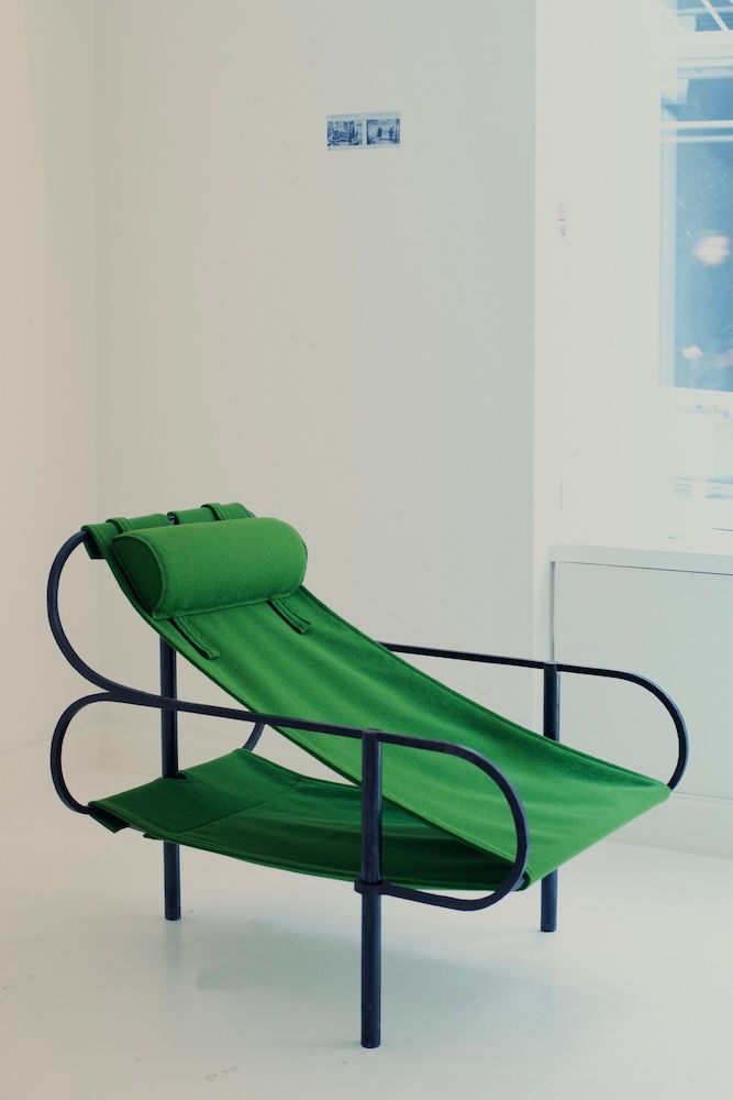 Green chair with black metal structure by Marie & Alexandre for Galerie signé at Design Miami 2025
