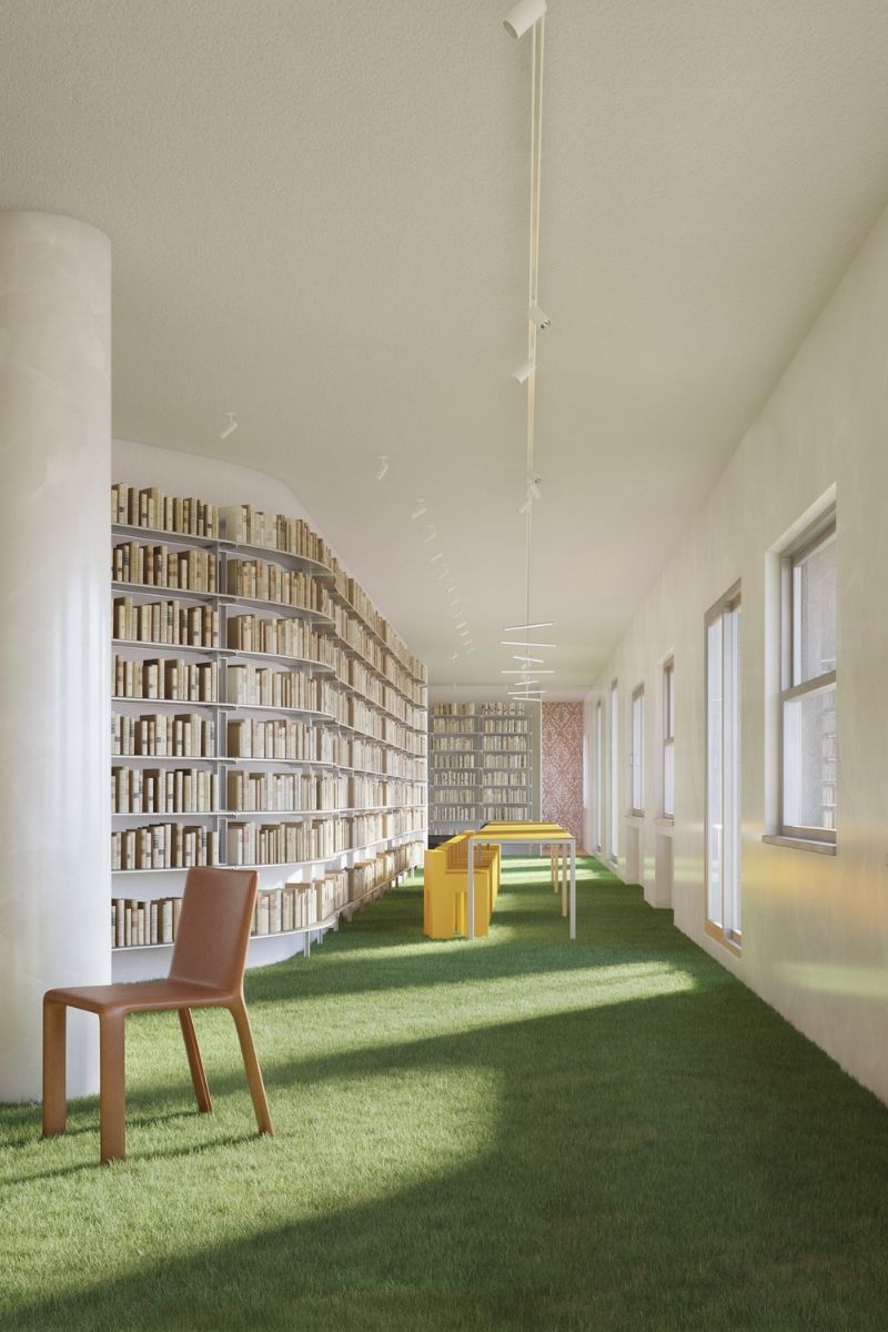 Apartment interior with grass-covered floor, bookcase-lined walls and yellow furniture in the background