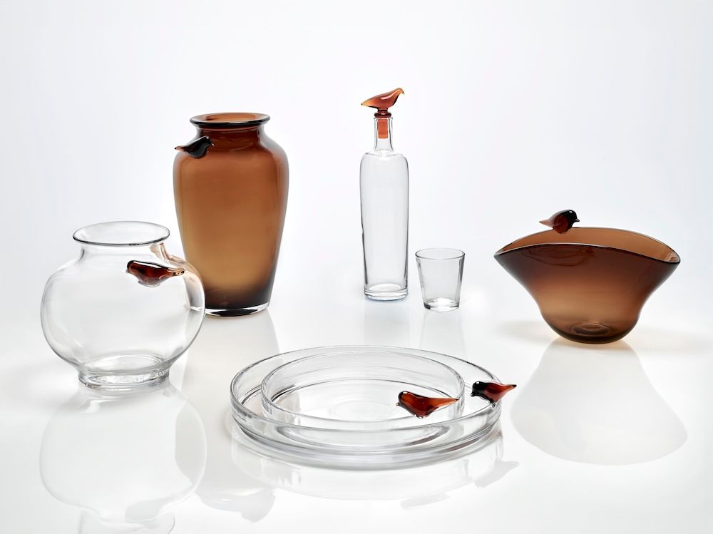 Collection of clear and amber-brown glass vases in varying shapes and sizes