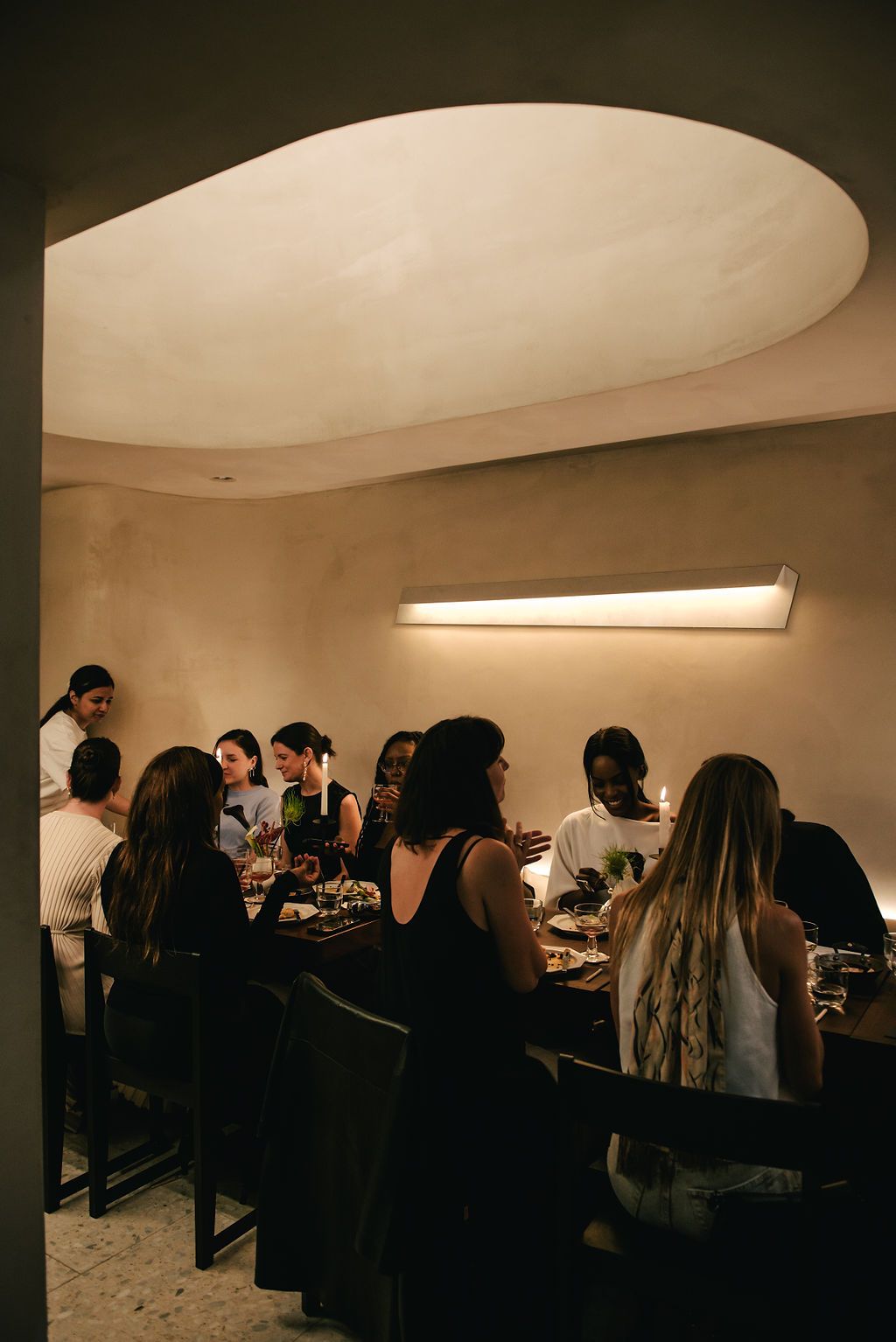 Guests enjoying dinner at H&MHome dinner at Holy Carrot restaurant in London