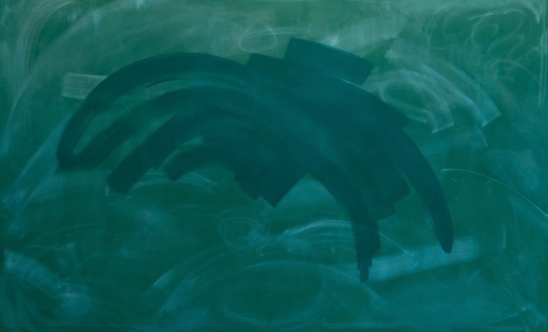 A chalkboard with remnants of erased chalk marks. A prominent dark green mark made with thick strokes is visible on top of the board