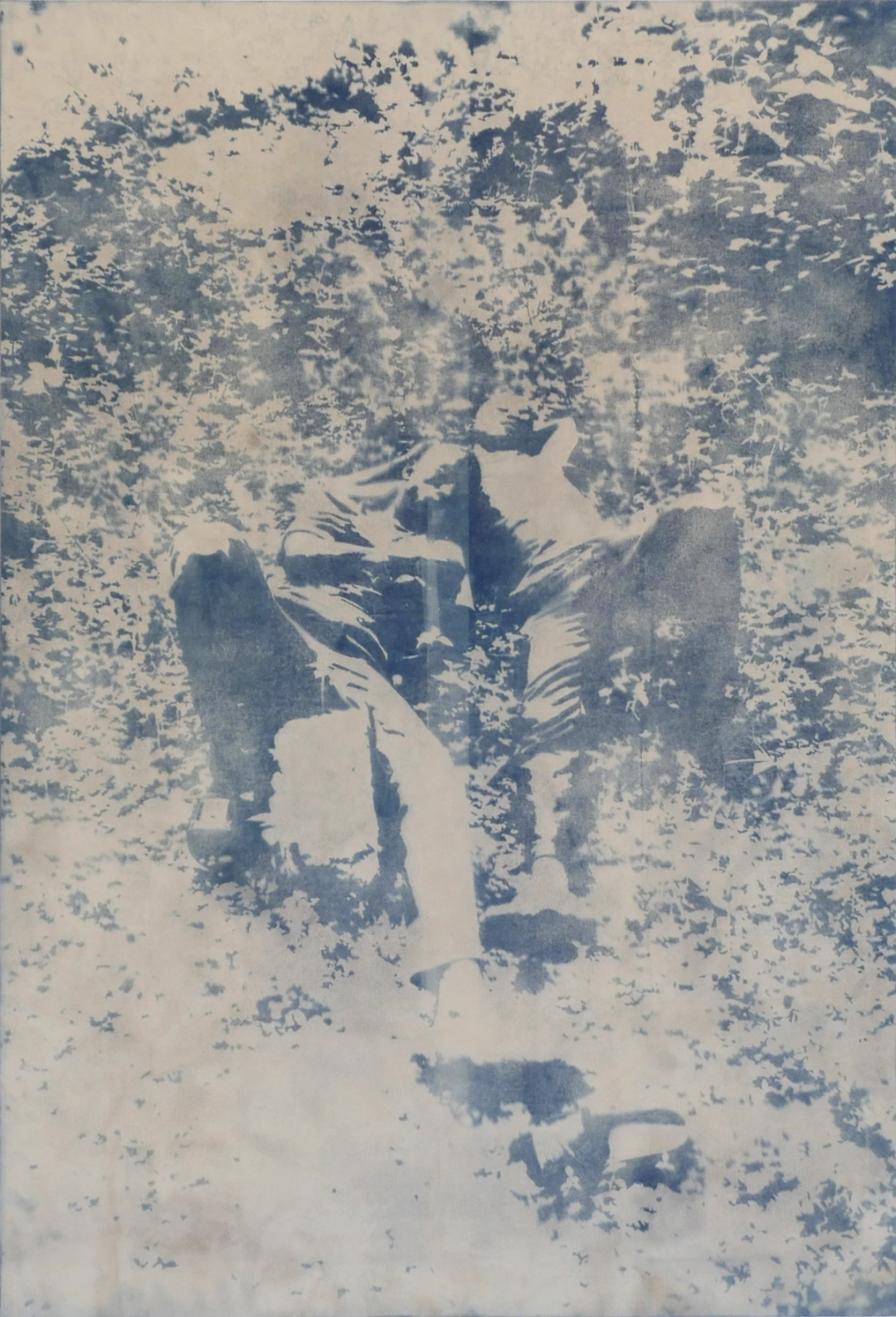 Two people reclining in the grass.