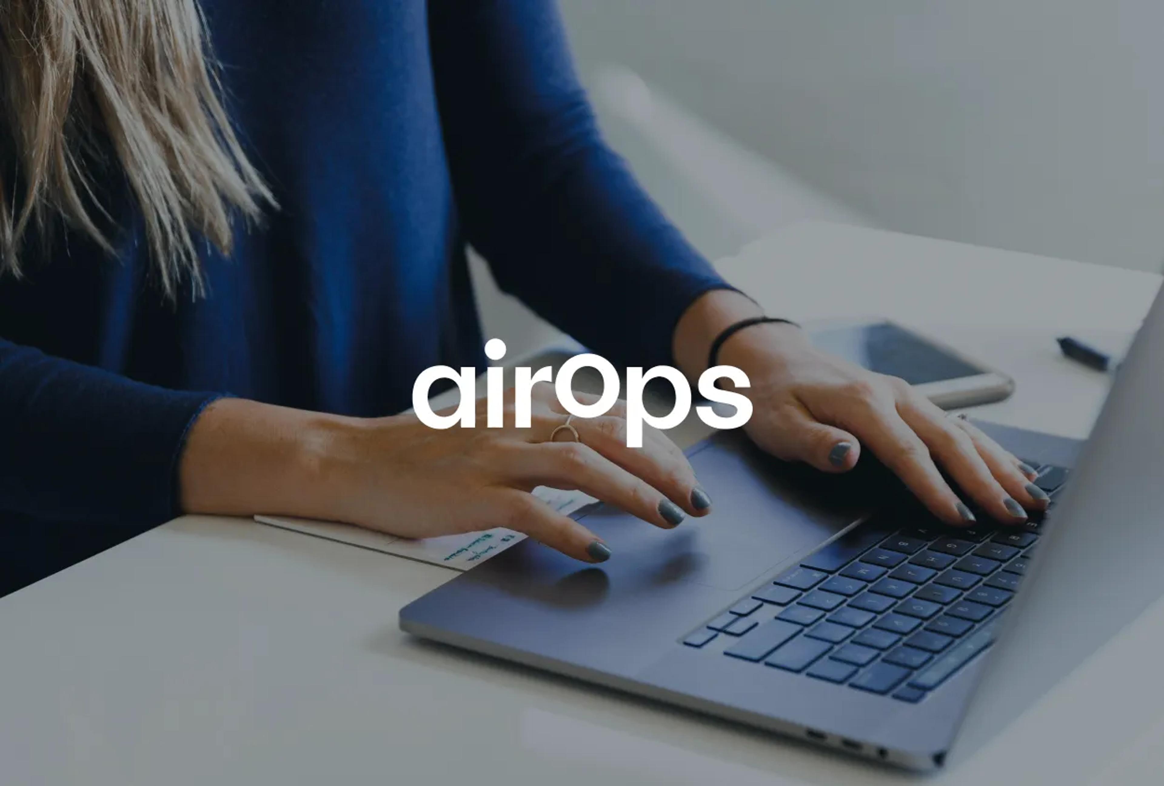 Person typing on a laptop with "airops" text overlaid.