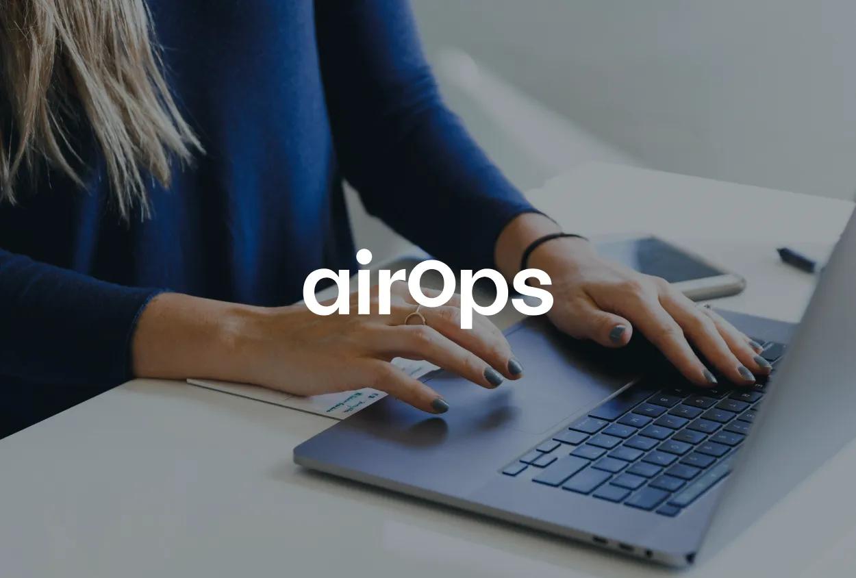 Person typing on a laptop with "airops" text overlaid.