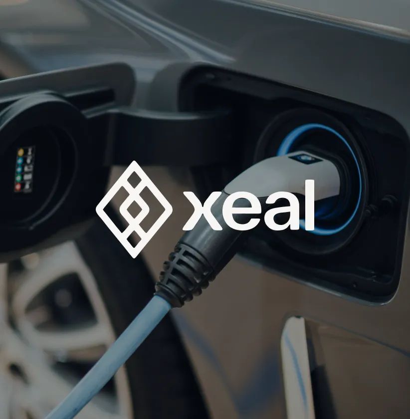 Xeal logo over an electric car charging with a blue glowing port.