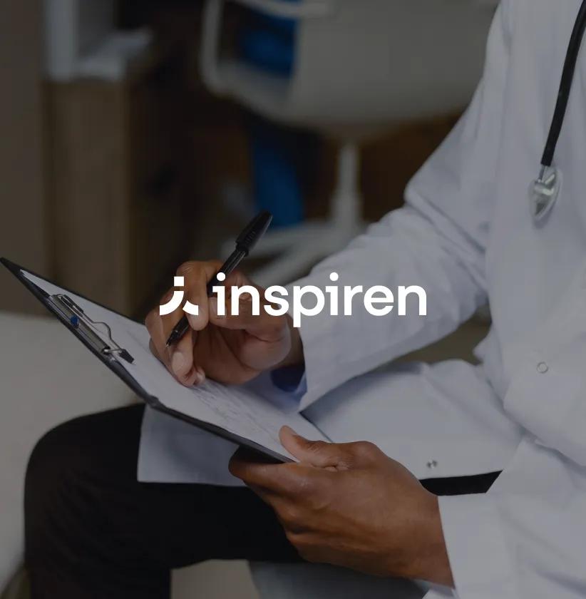 Inspiren logo over a doctor writing notes on a clipboard.