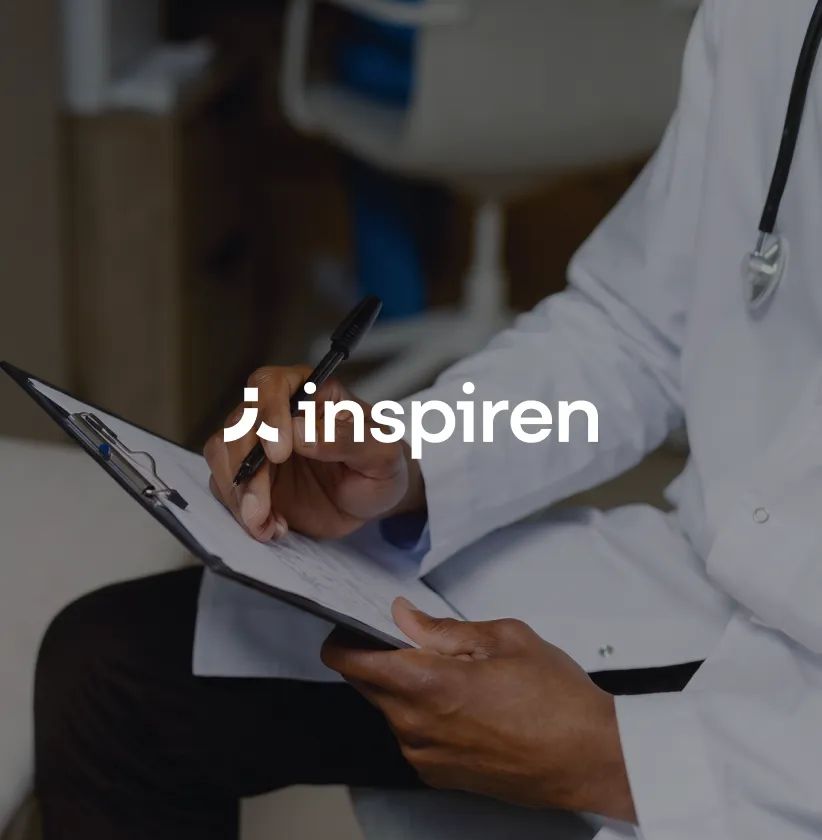 Inspiren logo over a doctor writing notes on a clipboard.