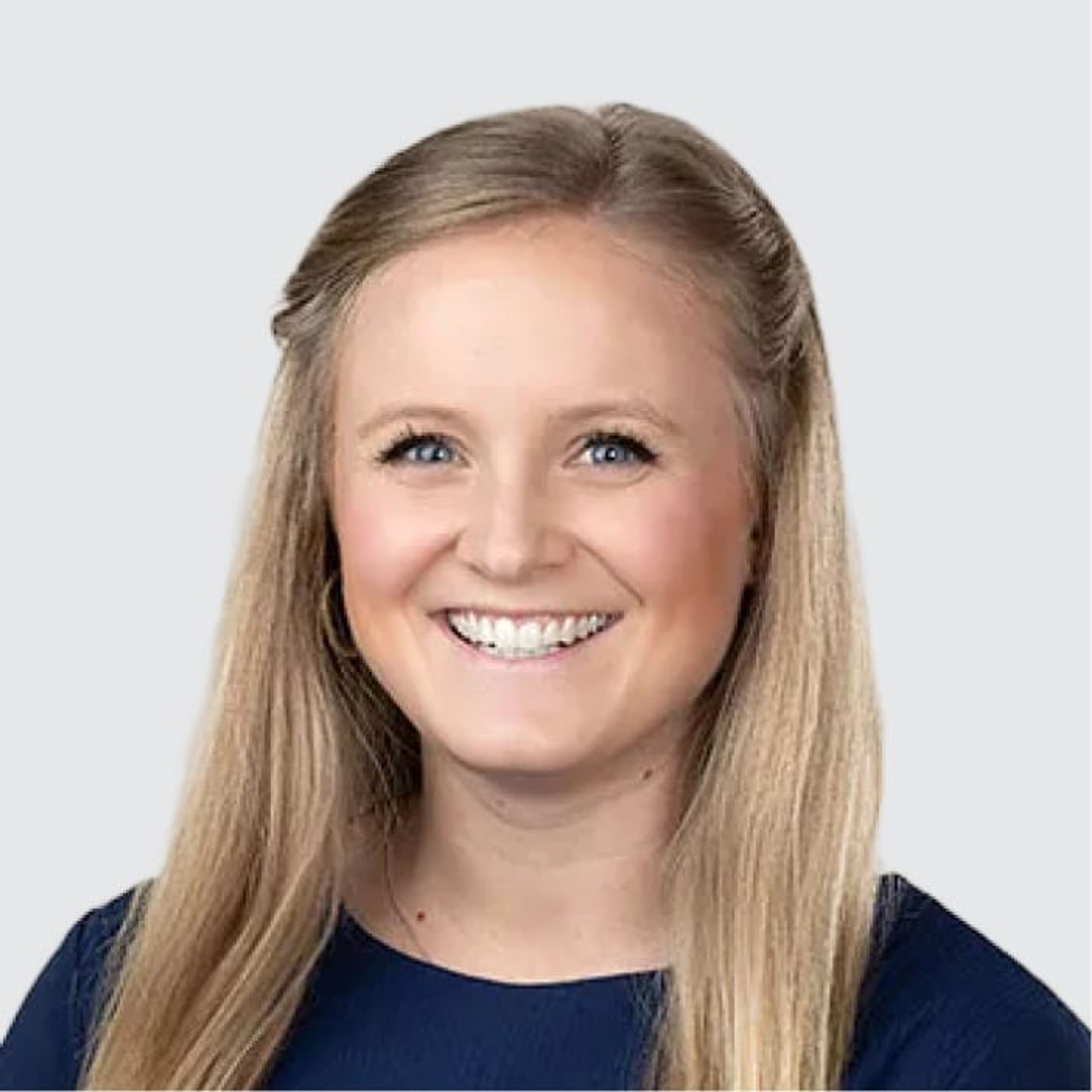 A smiling young woman with blonde hair and blue eyes.