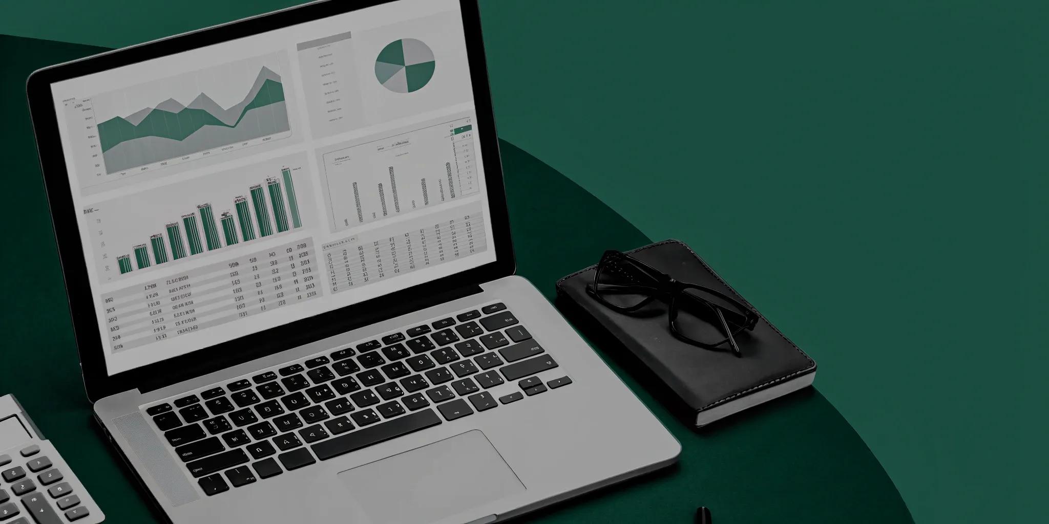 Accrual accounting software dashboard with financial charts on a laptop.