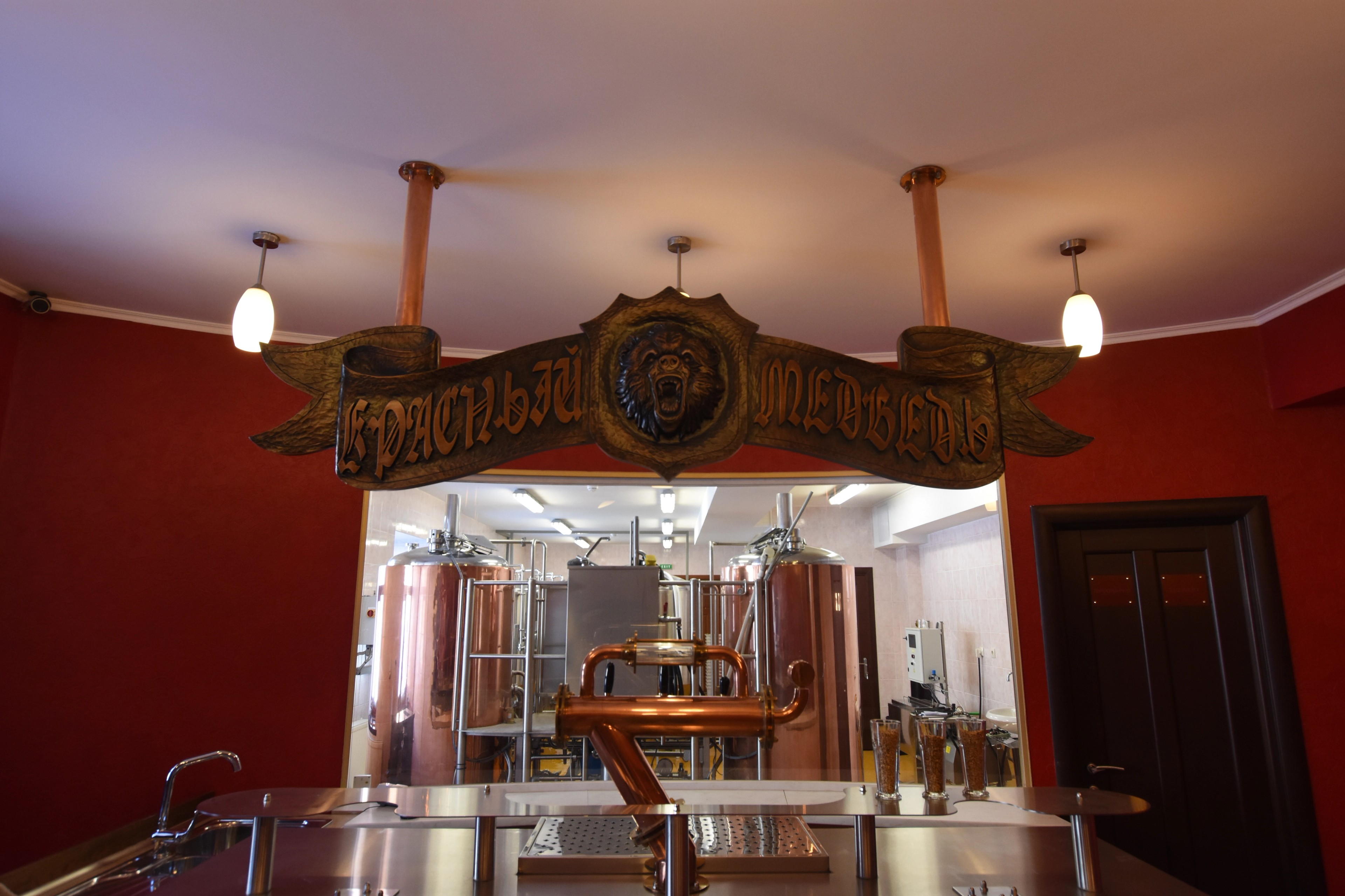 A display of historic equipment in a warmly lit room.