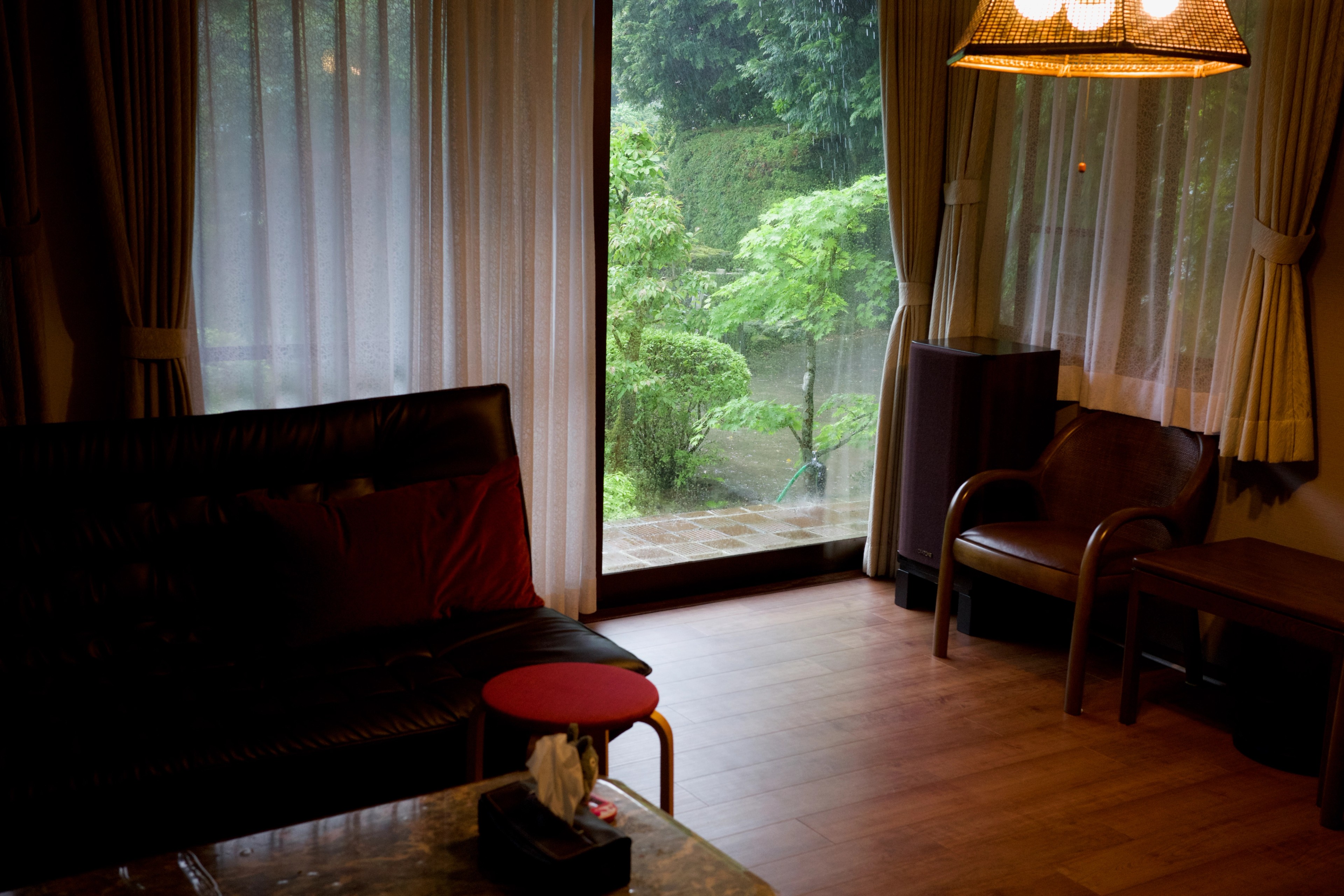 A quiet sitting room opens onto a garden.