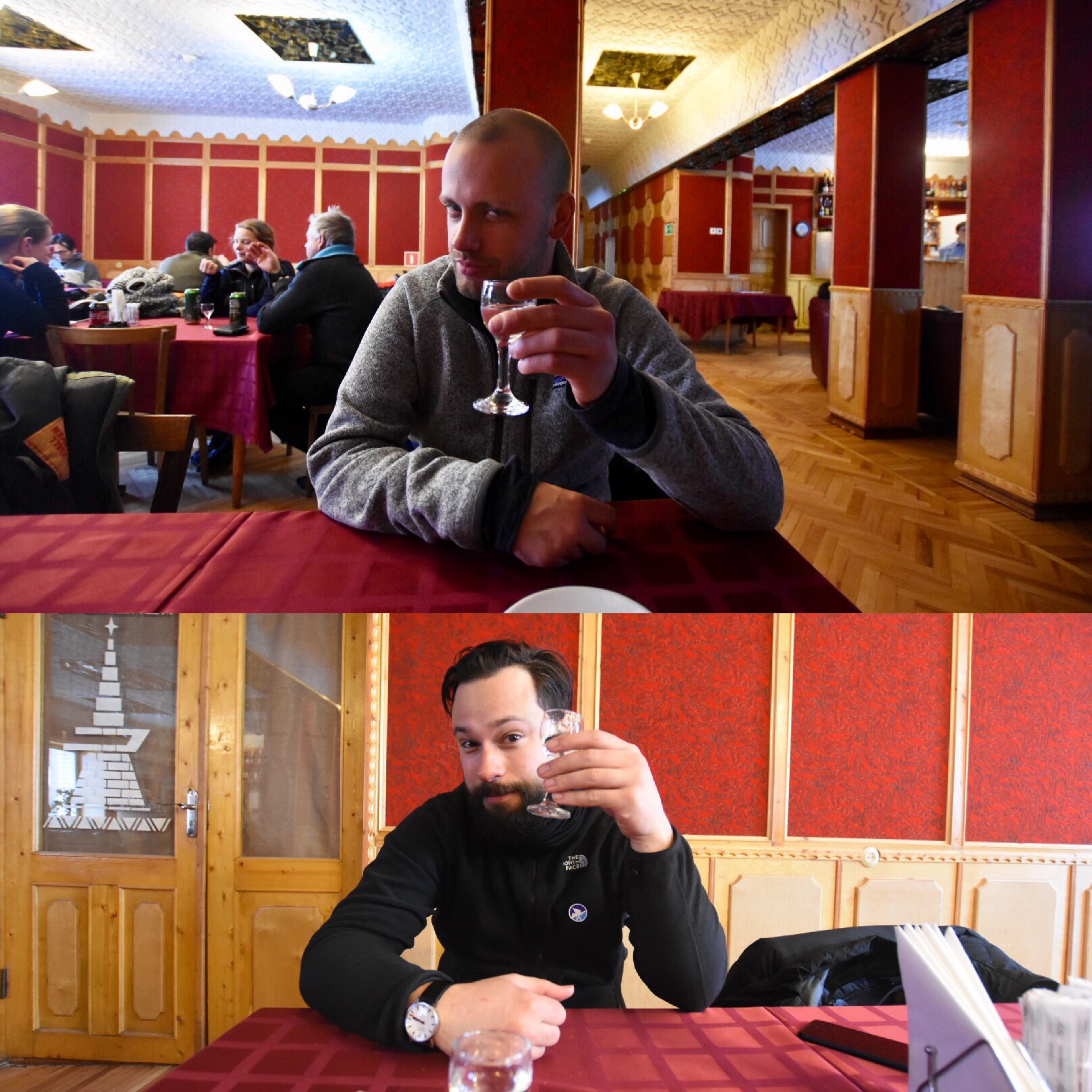 A person sits at a table in a warmly lit restaurant.