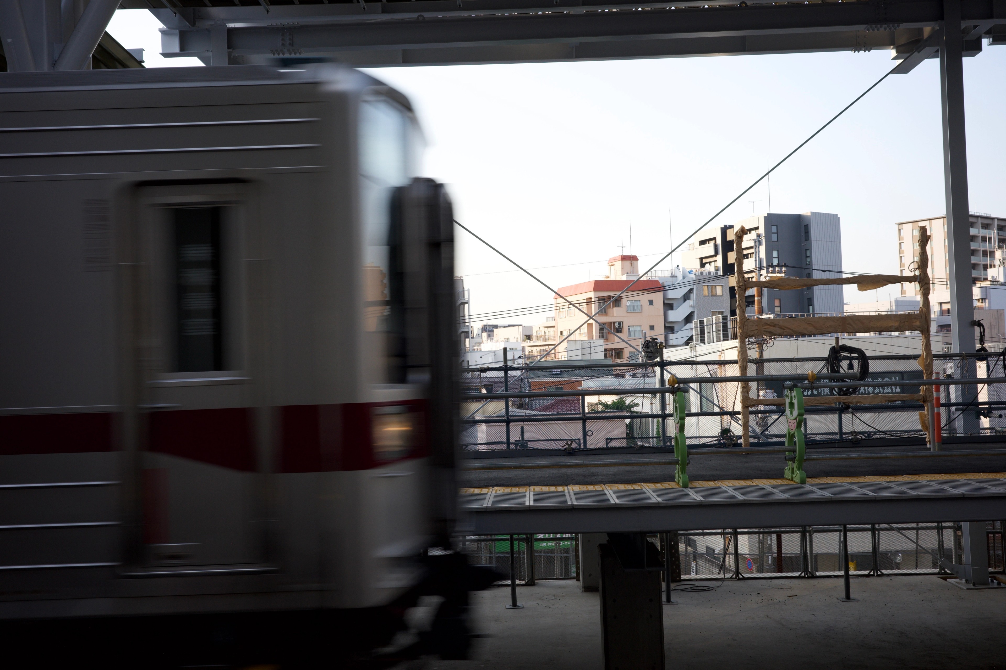 A train passes through an elevated station.