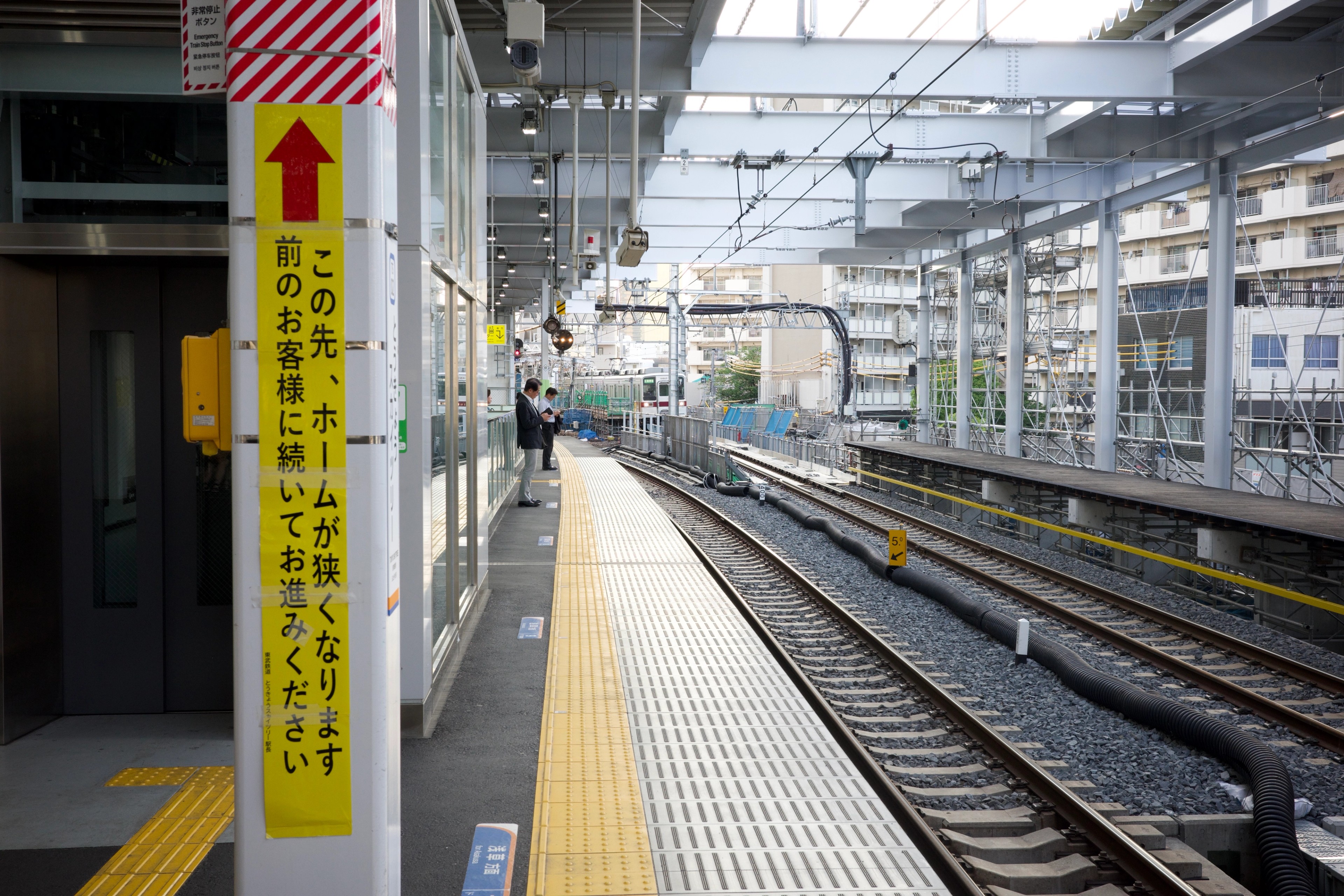 Tracks and a platform at a local railway station.